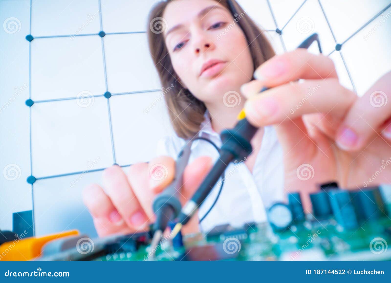 Girl with Measuring Devices in the Electronics Laboratory Stock Photo