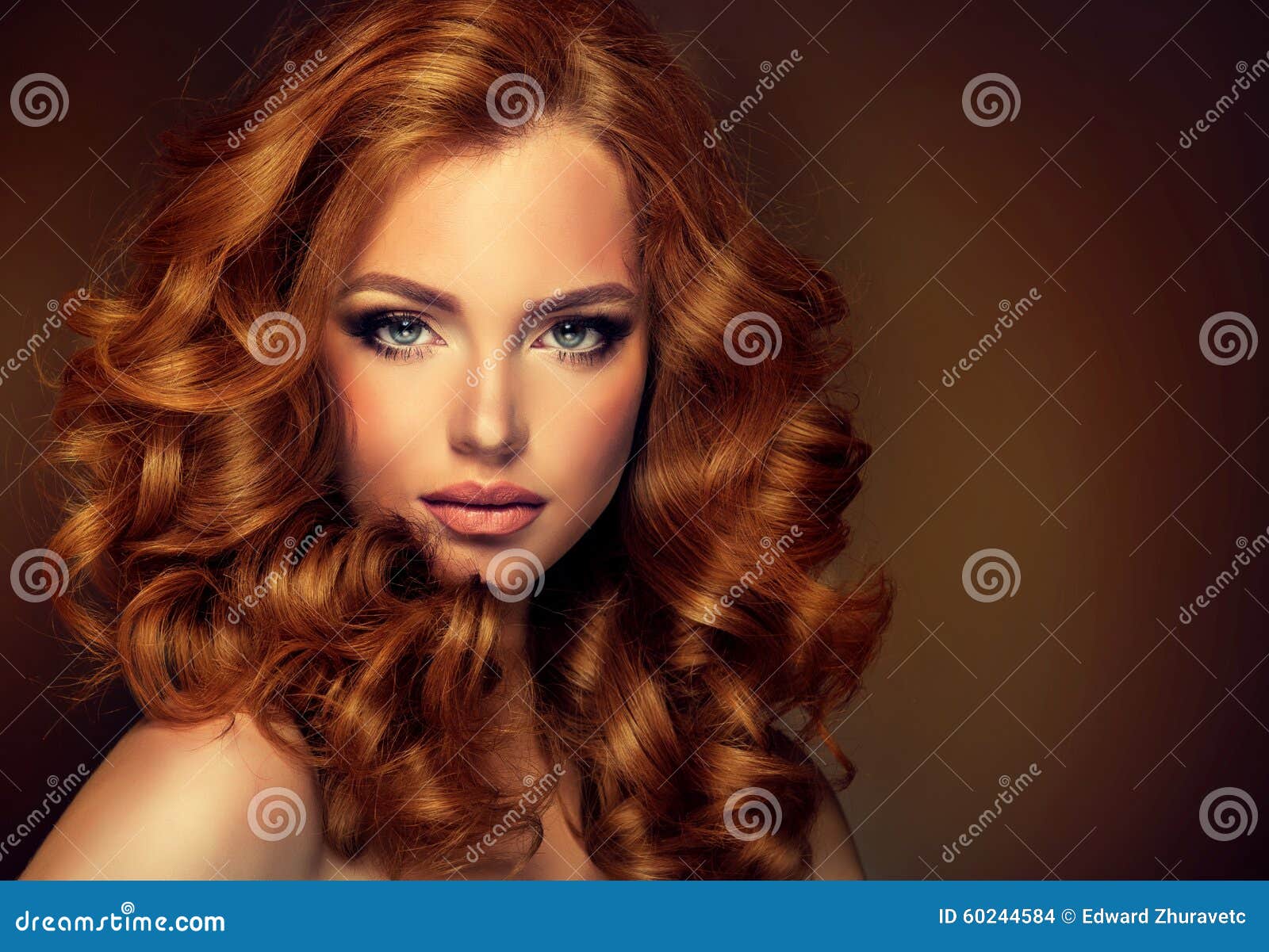 girl model with long curly red hair.