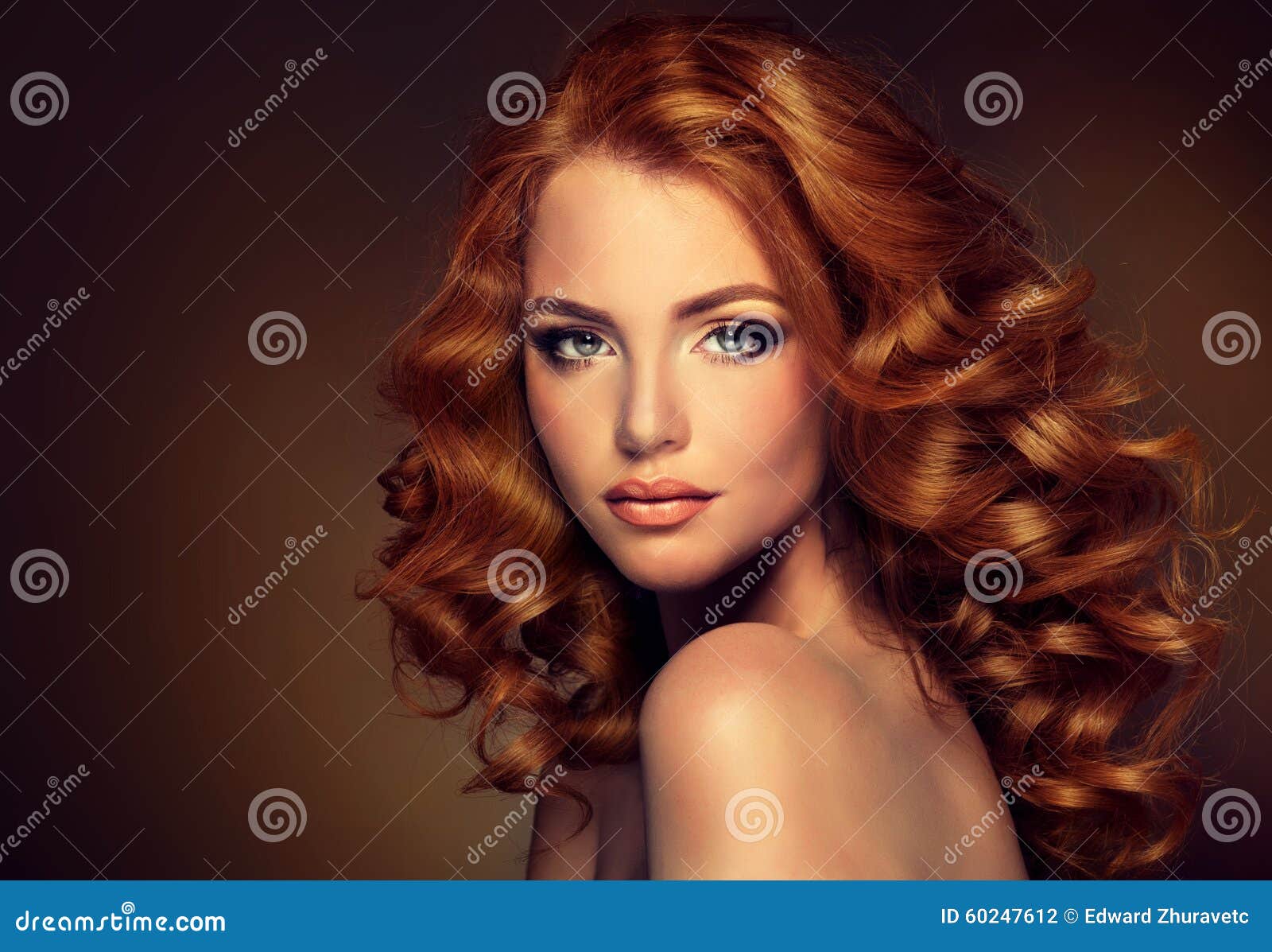 girl model with long curly red hair.