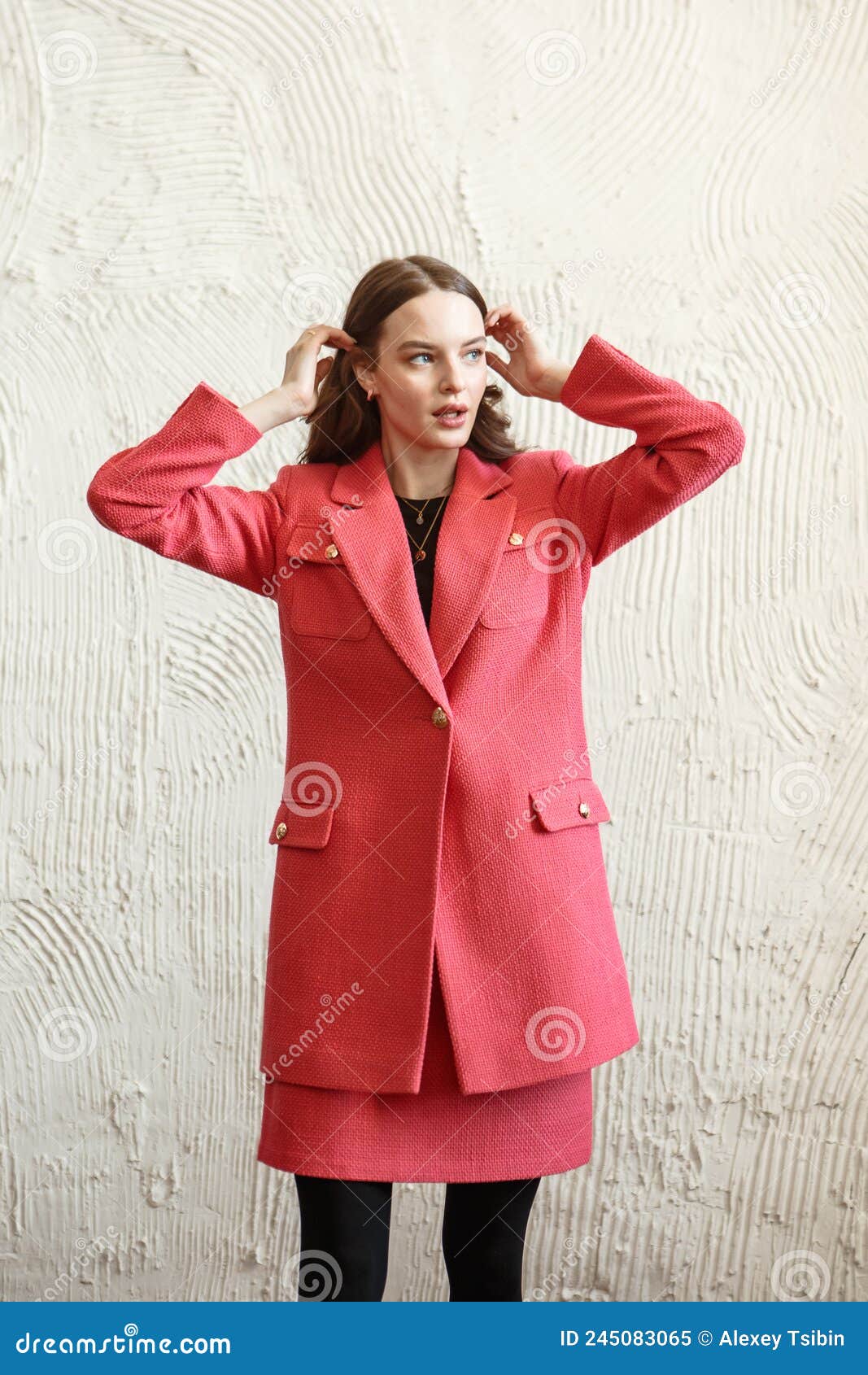 A Girl Model in Pink Clothes in the Studio. Shooting Fashionable ...