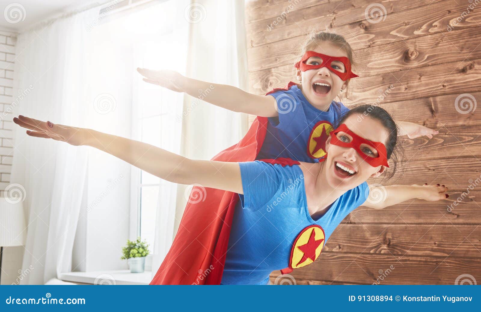 girl and mom in superhero costumes
