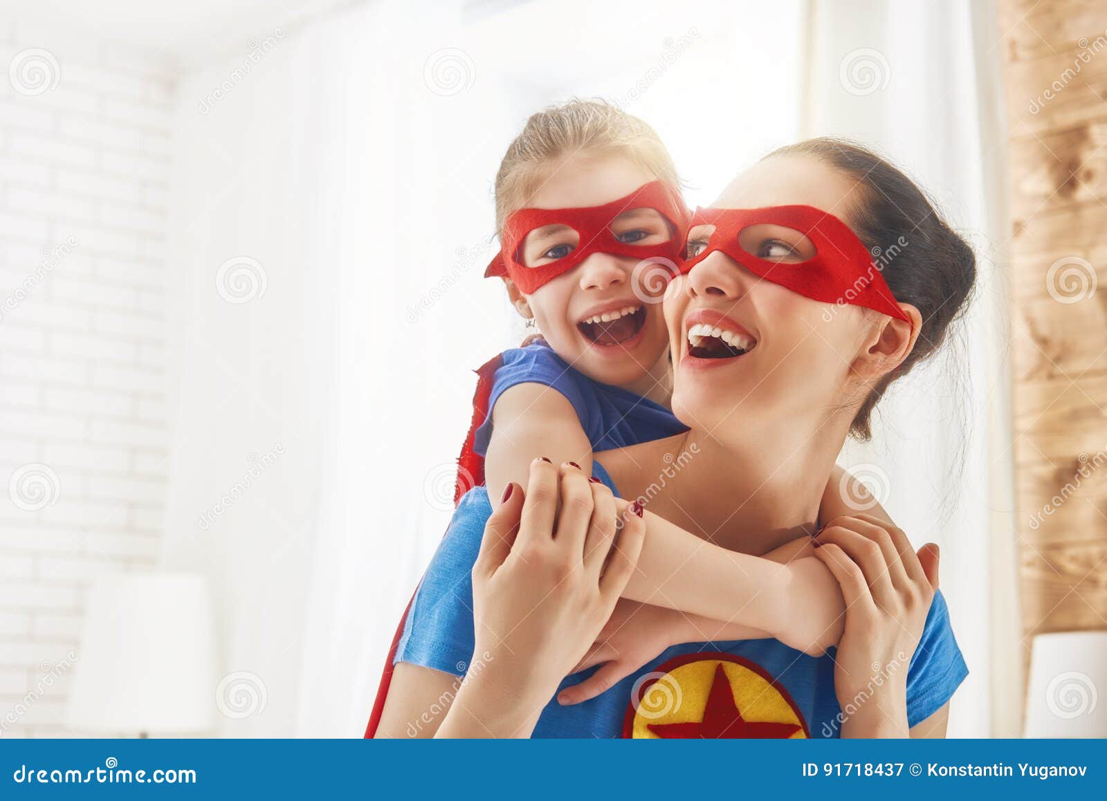 girl and mom in superhero costumes