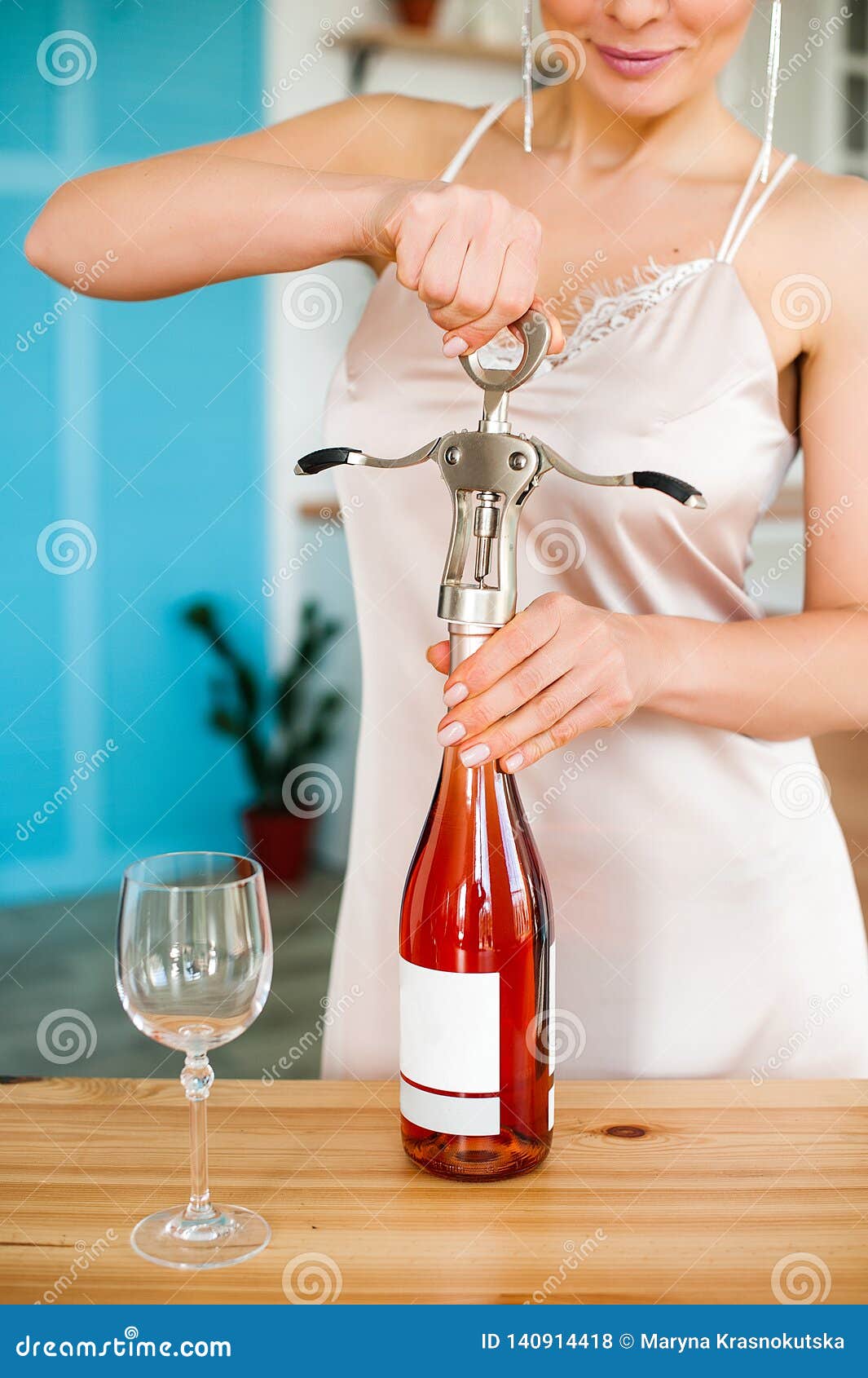 Girl Opens a Bottle of Wine with a Corkscrew Stock Photo Image of