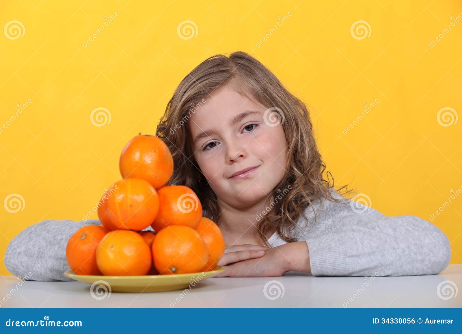 Girl with oranges stock photo. Image of color, orange 34330056