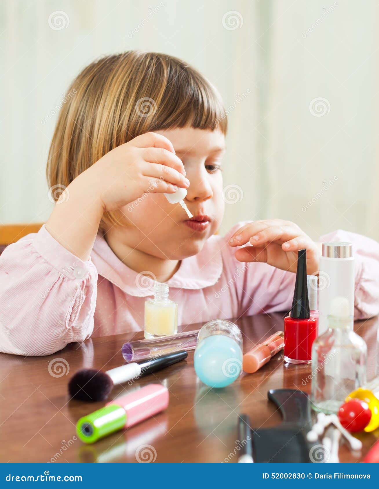 Girl paints her nails stock photo. Image of female, hair 52002830