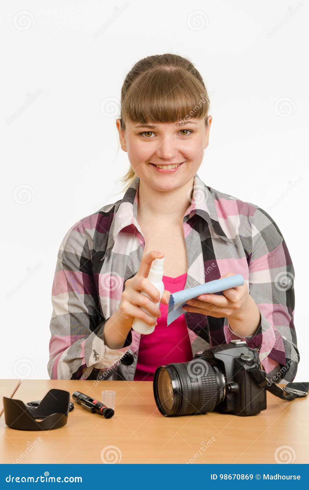 Girl Photographer Performs Cleaning of Camera Body from External