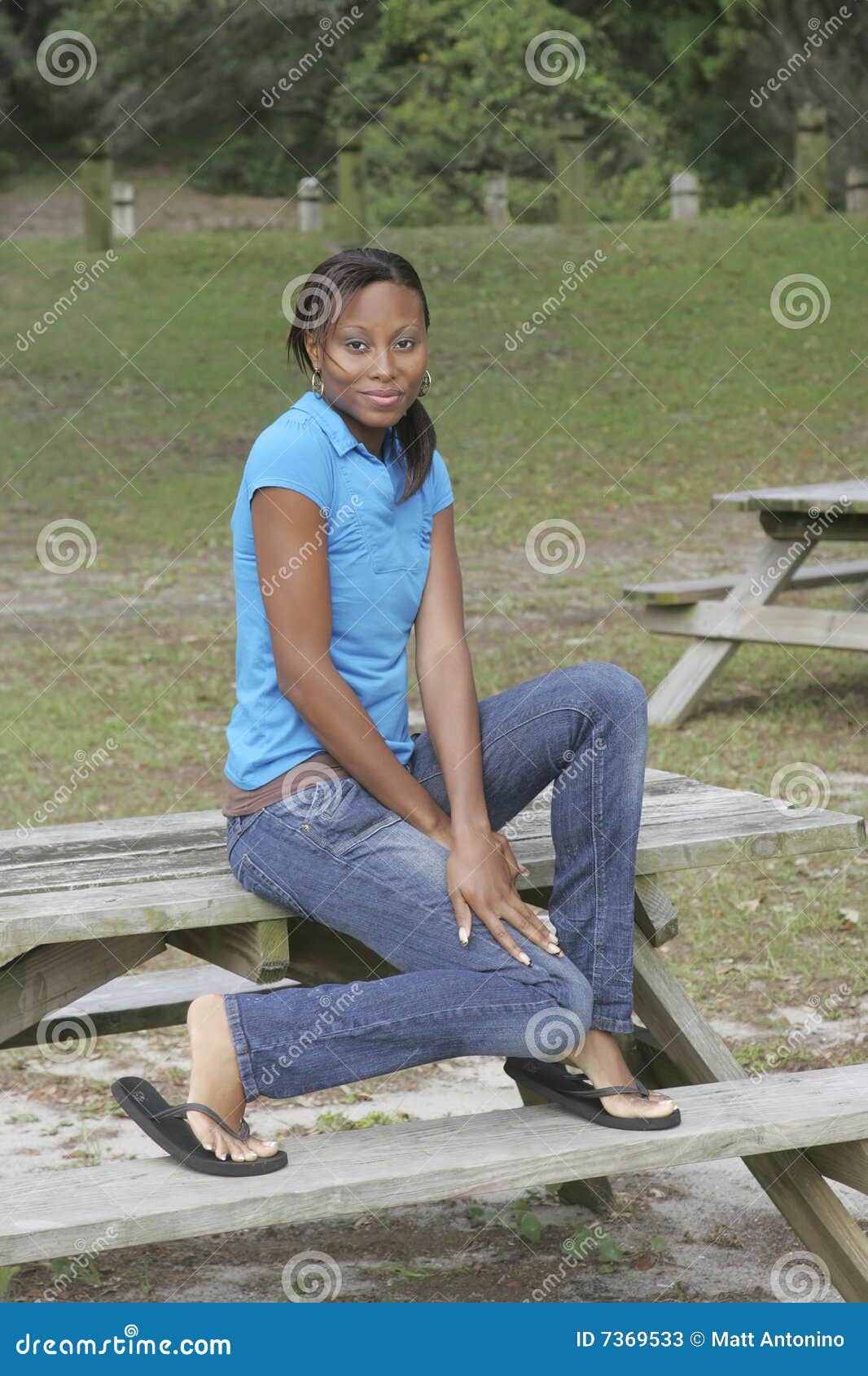 Girl on picnic table stock image. Image of stare, lean 7369533