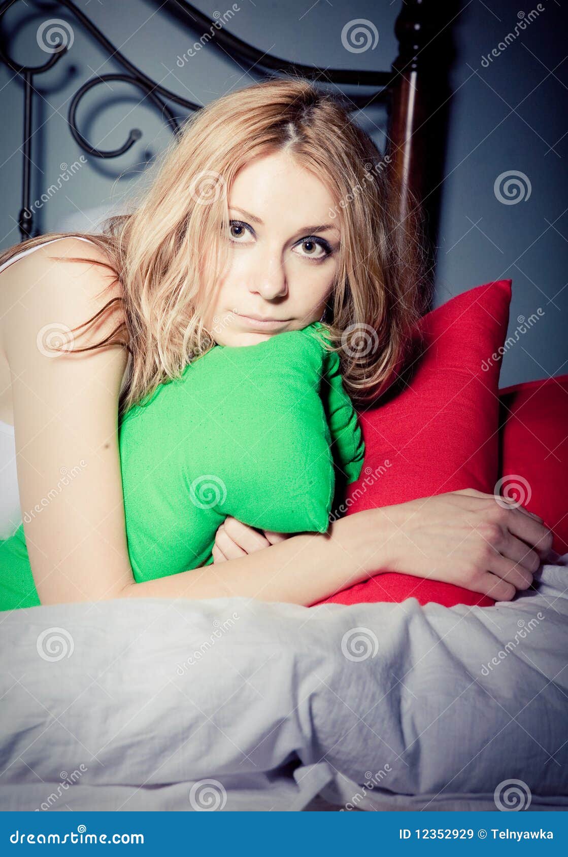 Girl and pillows stock image. Image of blond, indoors - 12352929