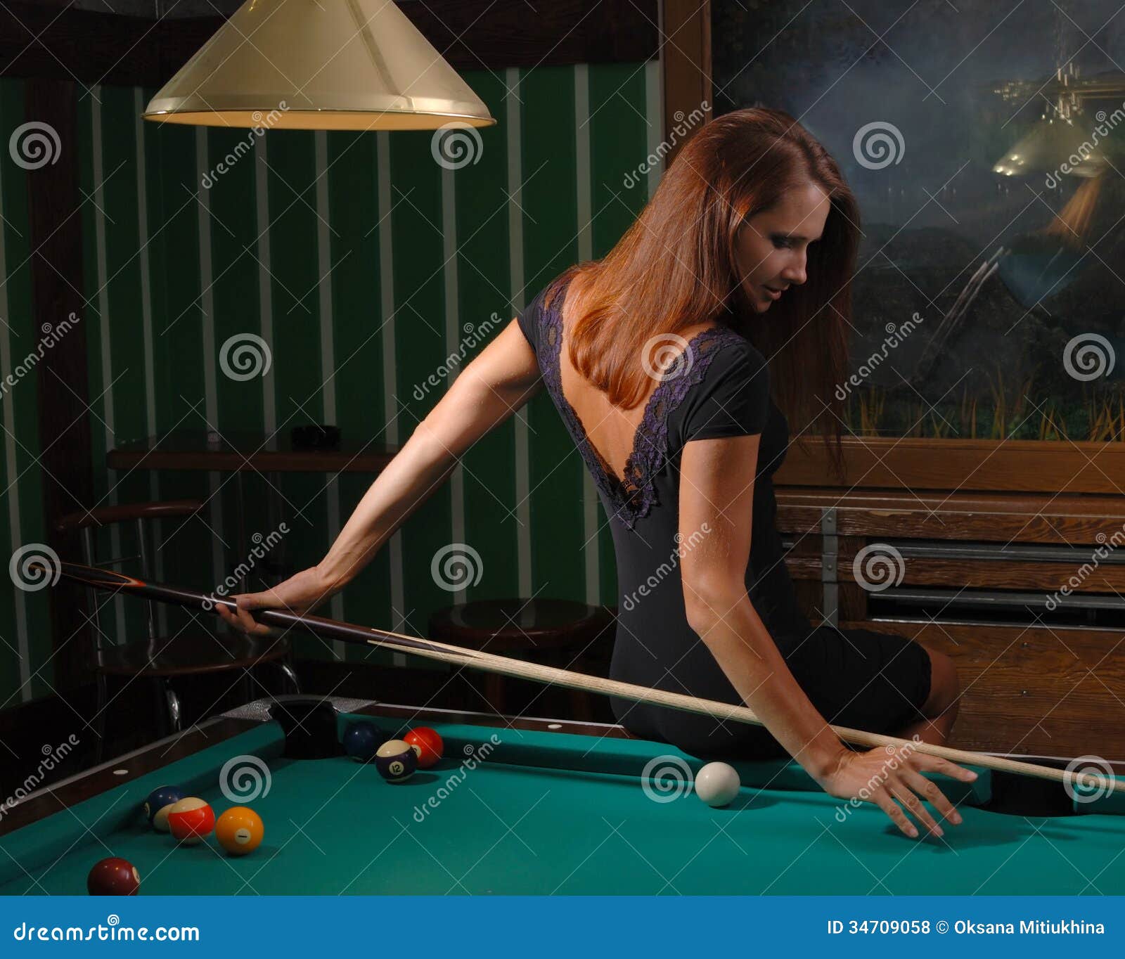 Premium Photo  Beautiful young girl came on a weekend to play billiards  for curiosity concept of a girl playing billiards