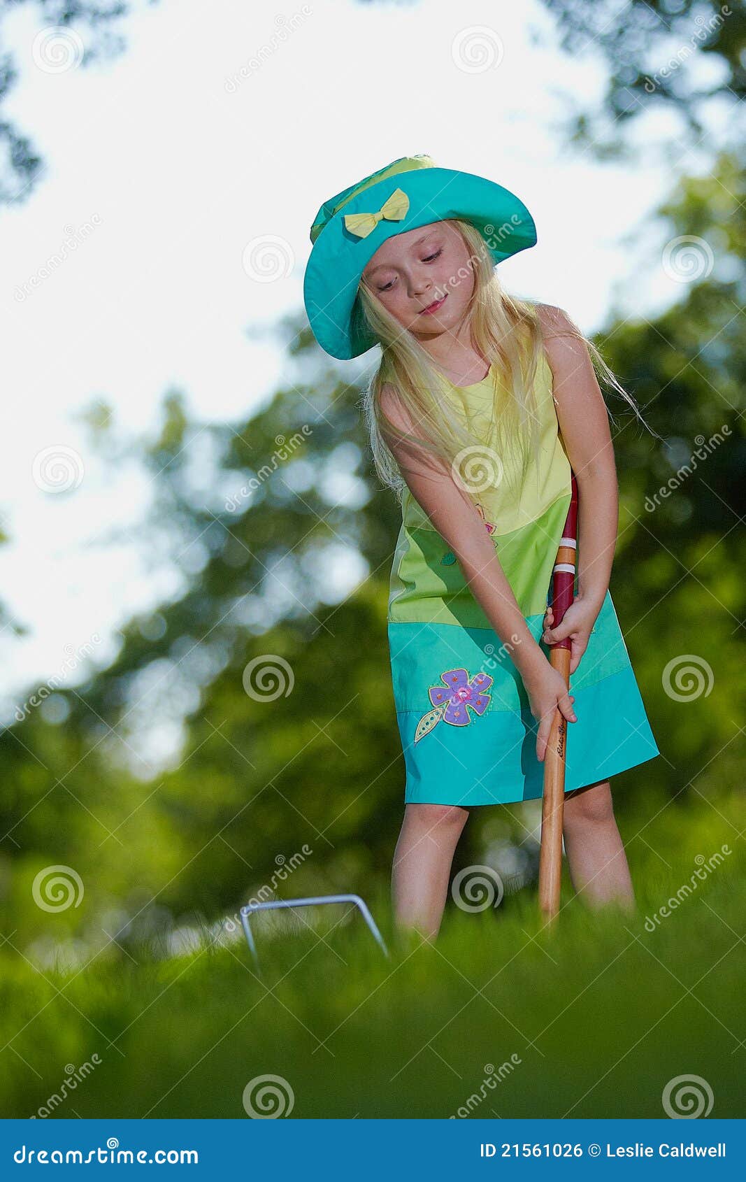 Girl playing croquet stock photo. Image of field, plays 21561026