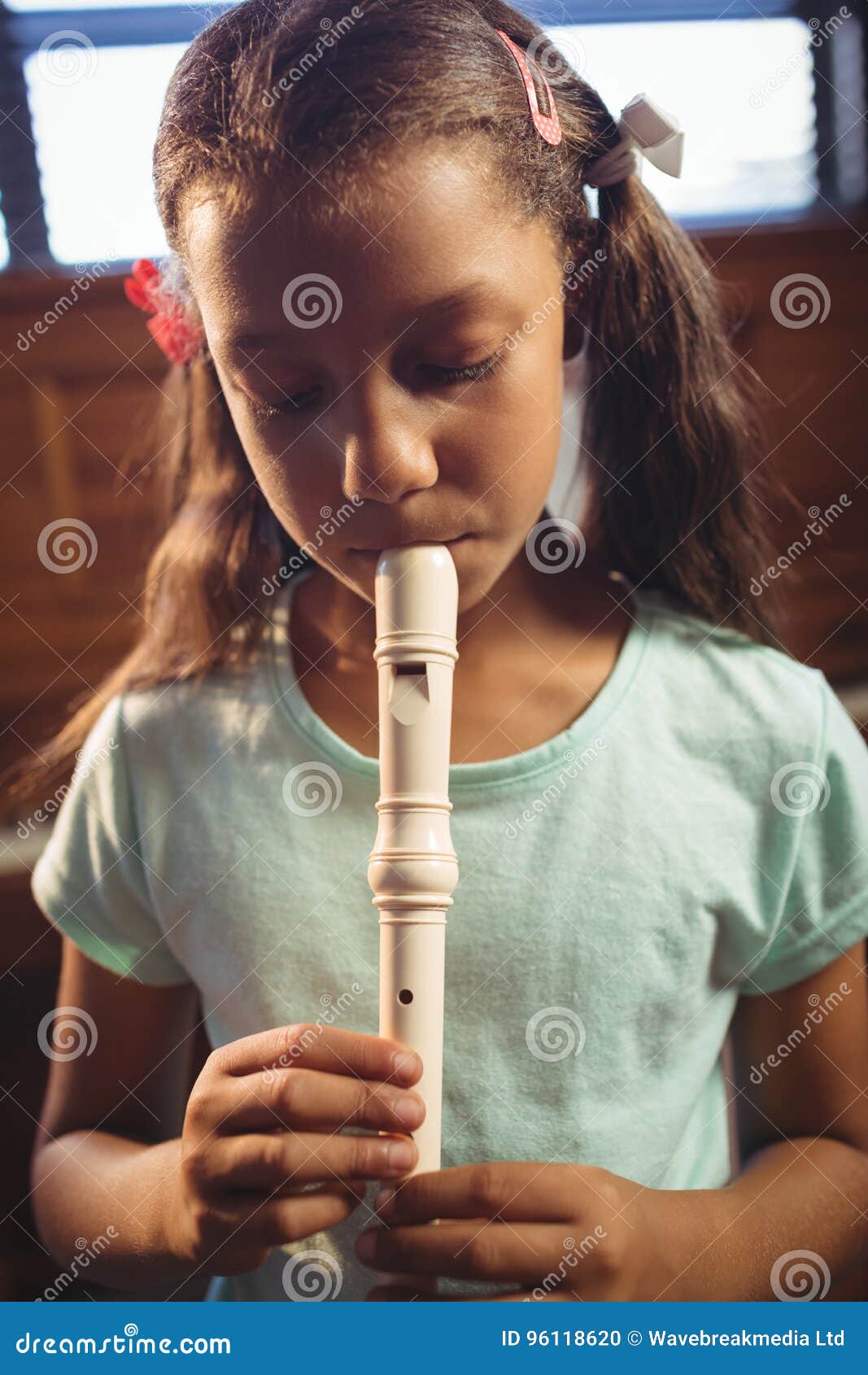Girl Playing Flute in Classroom Stock Photo Image of class, female