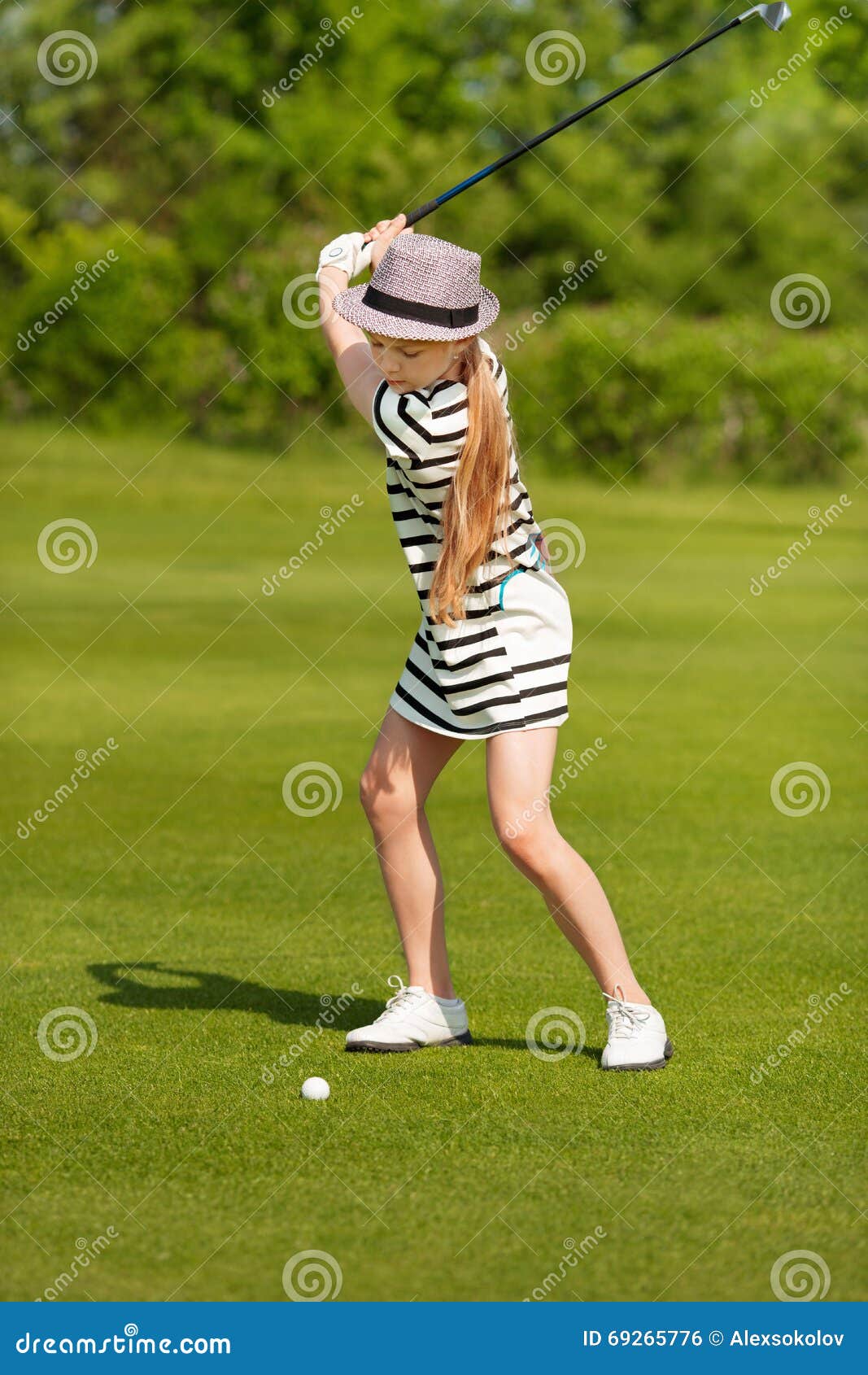 Girl playing golf stock photo. Image of activity, energy 69265776