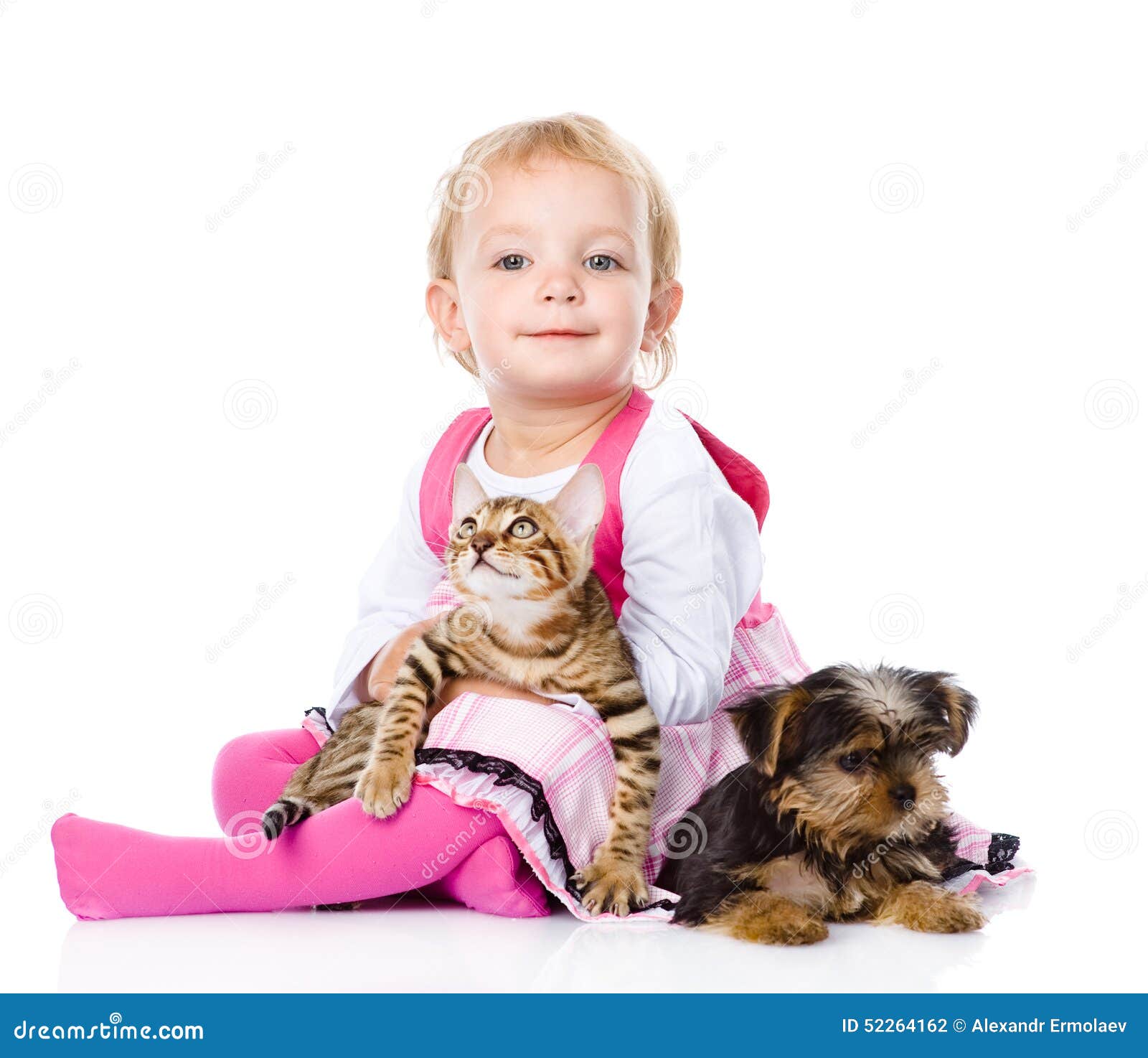 Girl Playing with Pets Dog and Cat. Looking at Camera Stock Photo