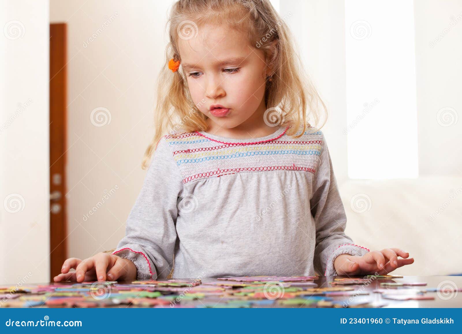 Girl playing puzzle stock photo. Image of home, preschooler 23401960