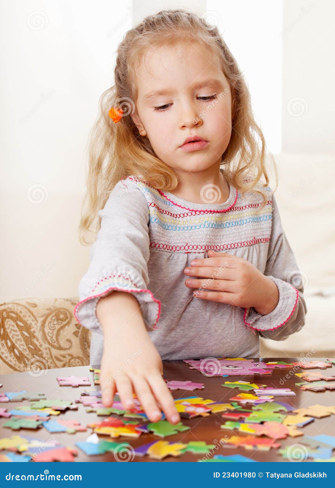 Girl playing puzzle stock photo. Image of cute, childhood 23401980
