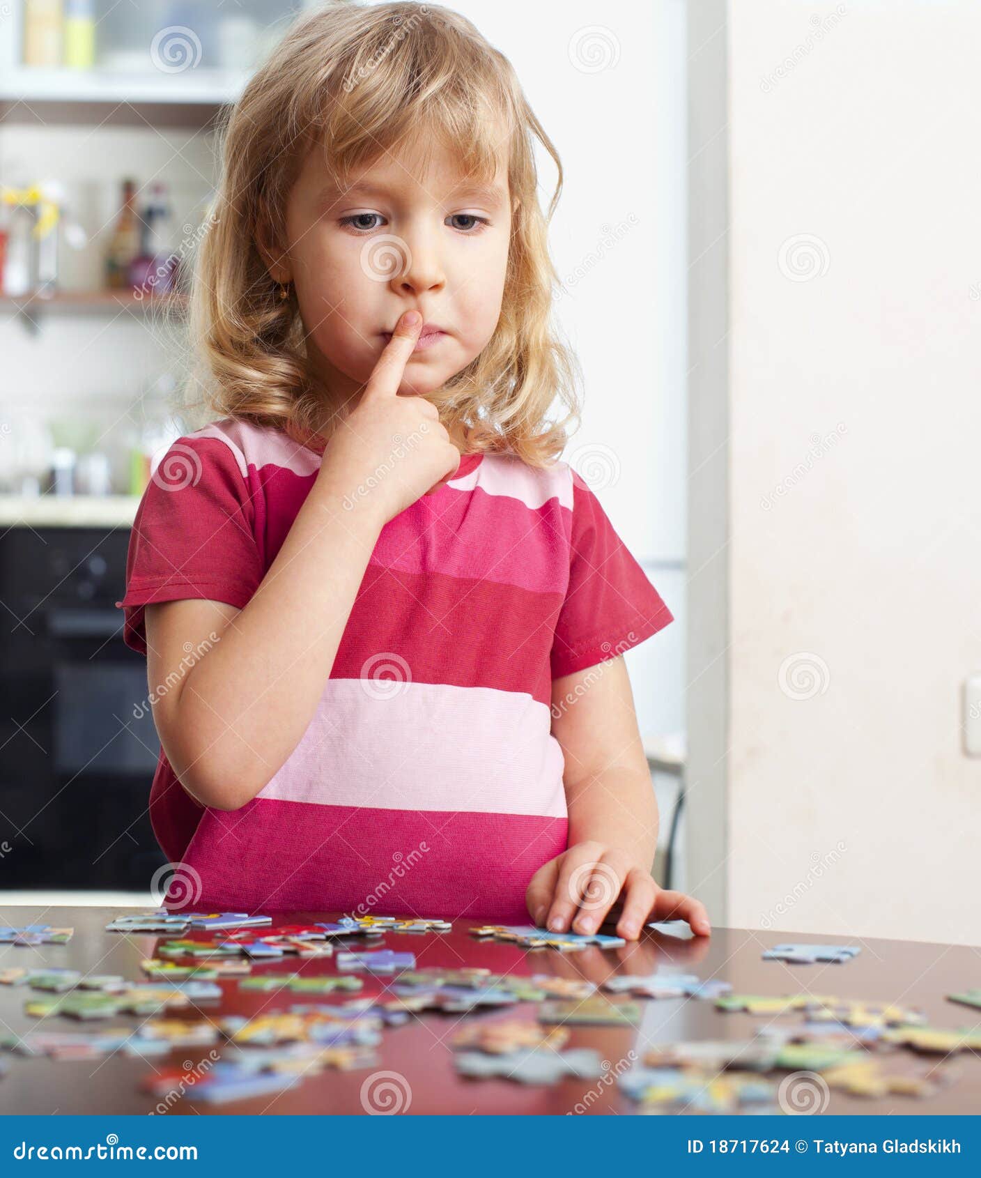 Girl, playing puzzles stock photo. Image of learning 18717624