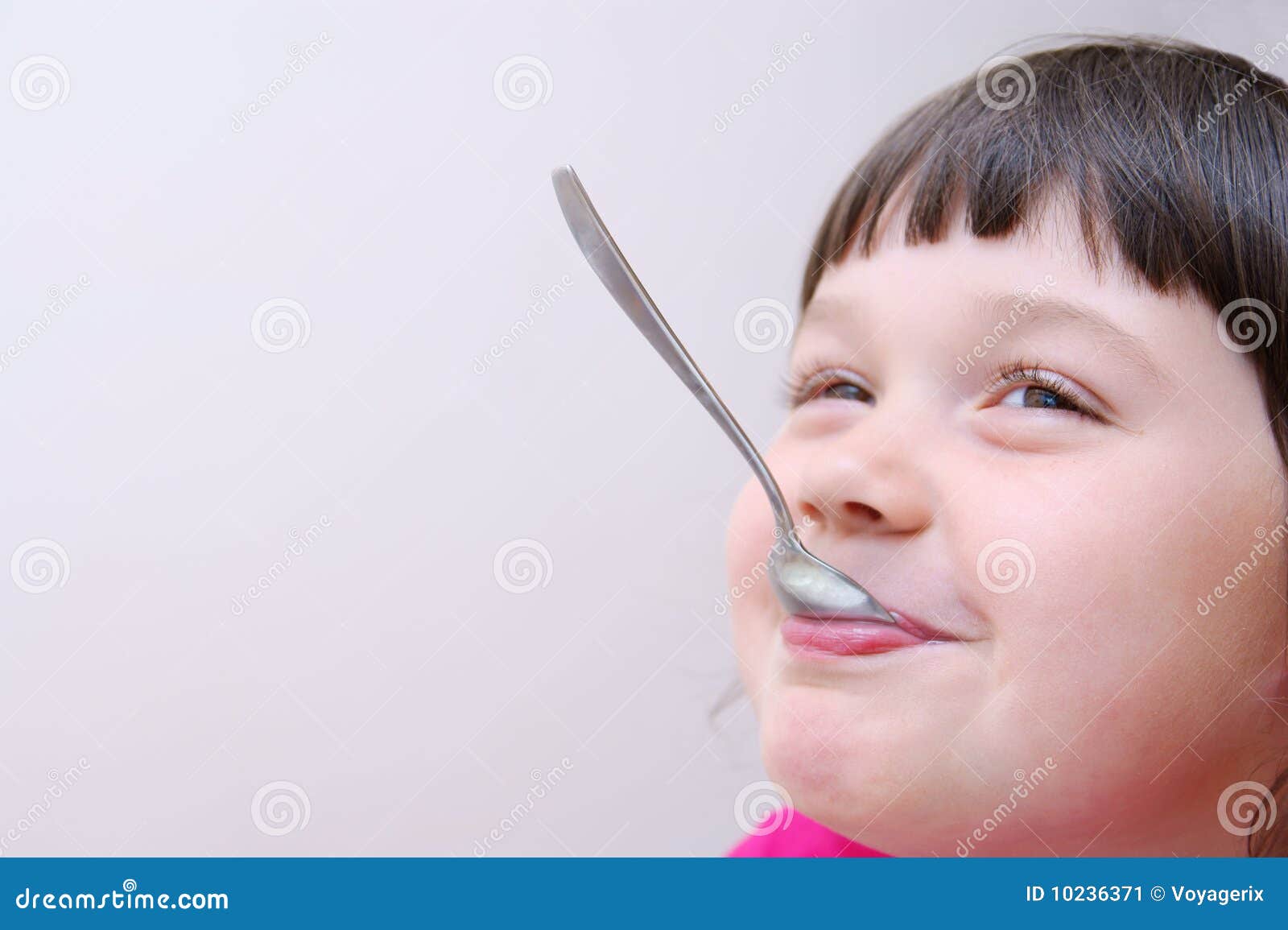 Girl playing with a spoon stock image. Image of girl 10236371