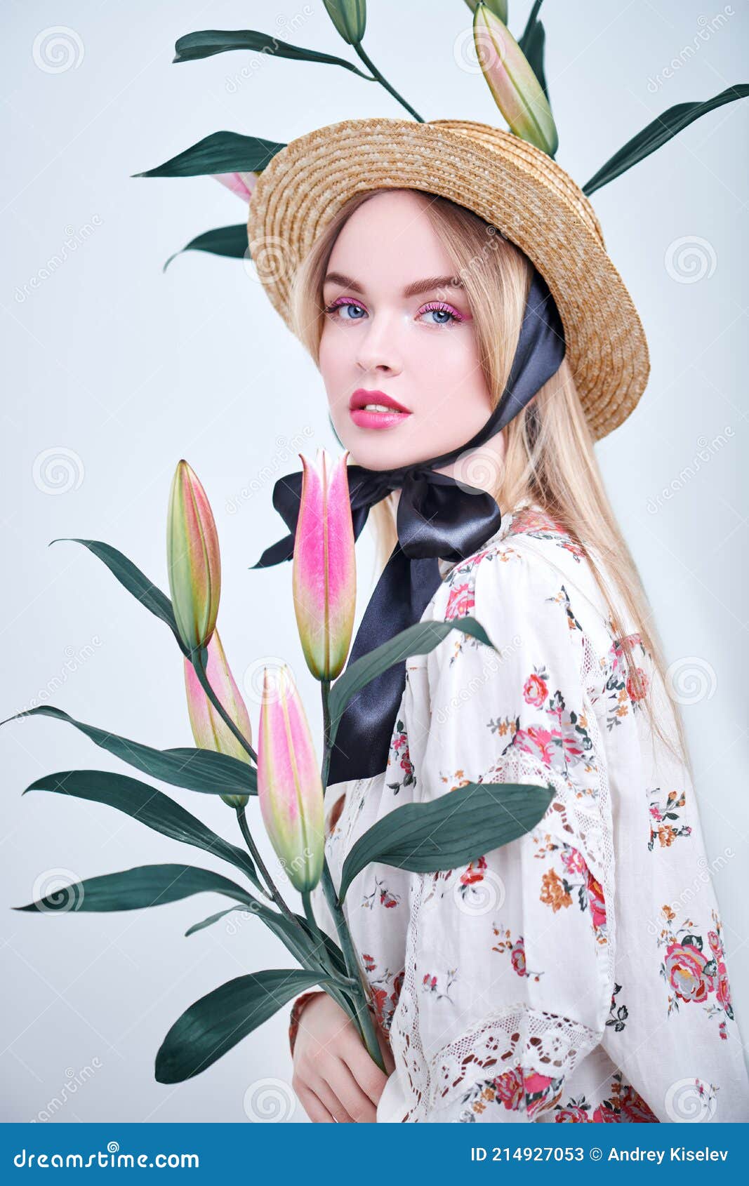 Photo of Woman in Floral outfit Posing by Blue Flowering Plant · Free Stock  Photo