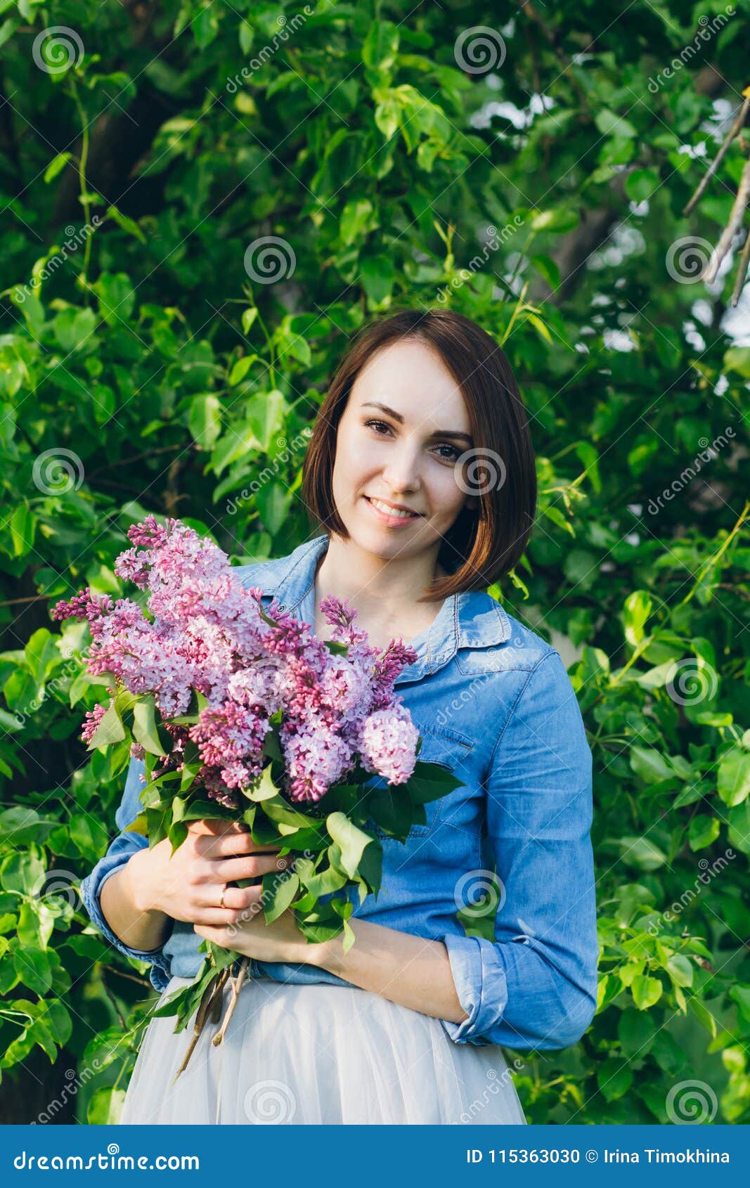 Girl Posing with a Bouquet of Lilac Stock Photo - Image of style ...
