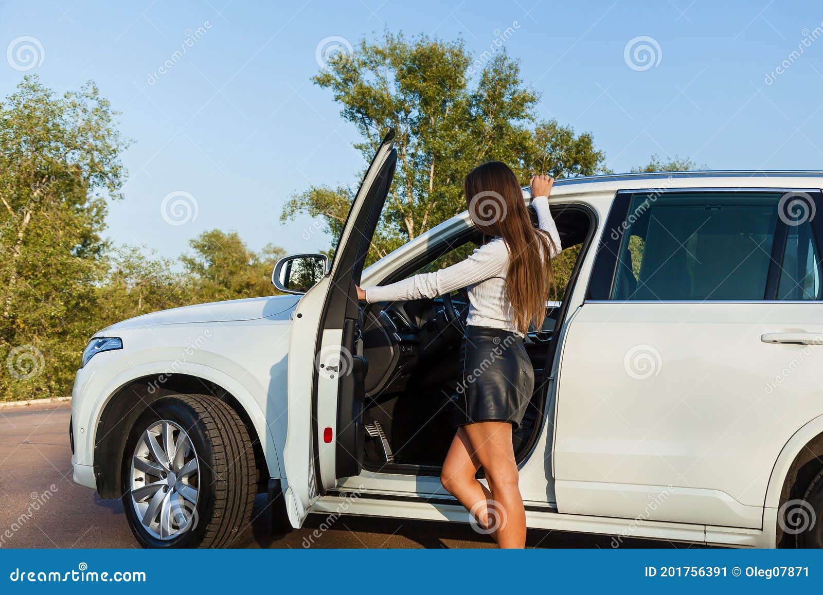 A Woman in Black Long Sleeves Posing while Sitting Inside the Car · Free  Stock Photo