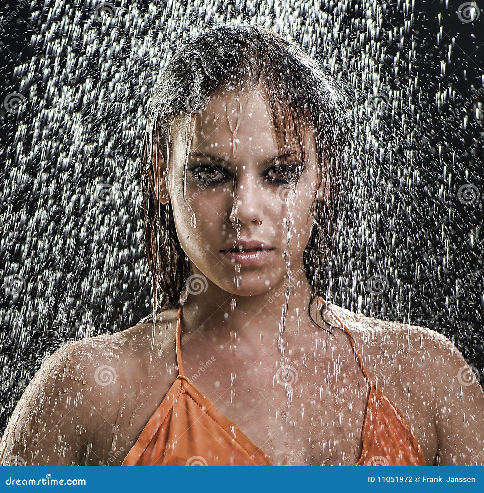 Girl posing in the rain stock photo. Image of orange 11051972