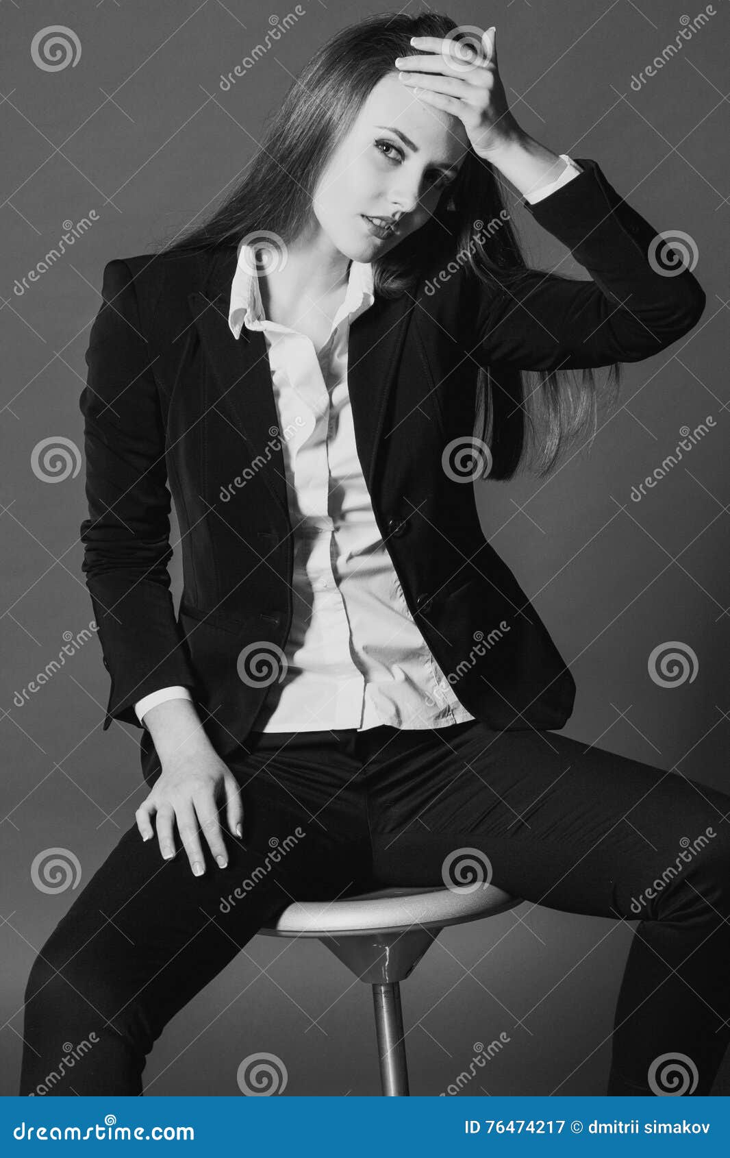 Girl model posing in the Studio on a Chair