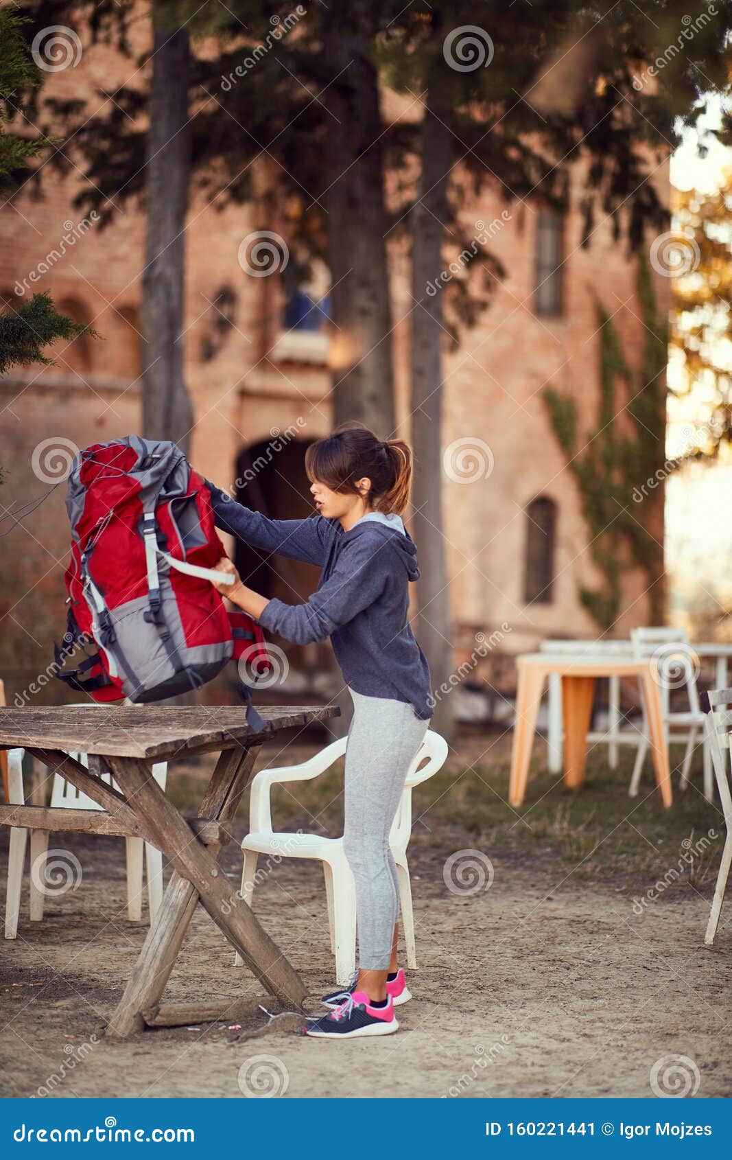 Girl Prepares a Backpack for the Trip Stock Image Image of group