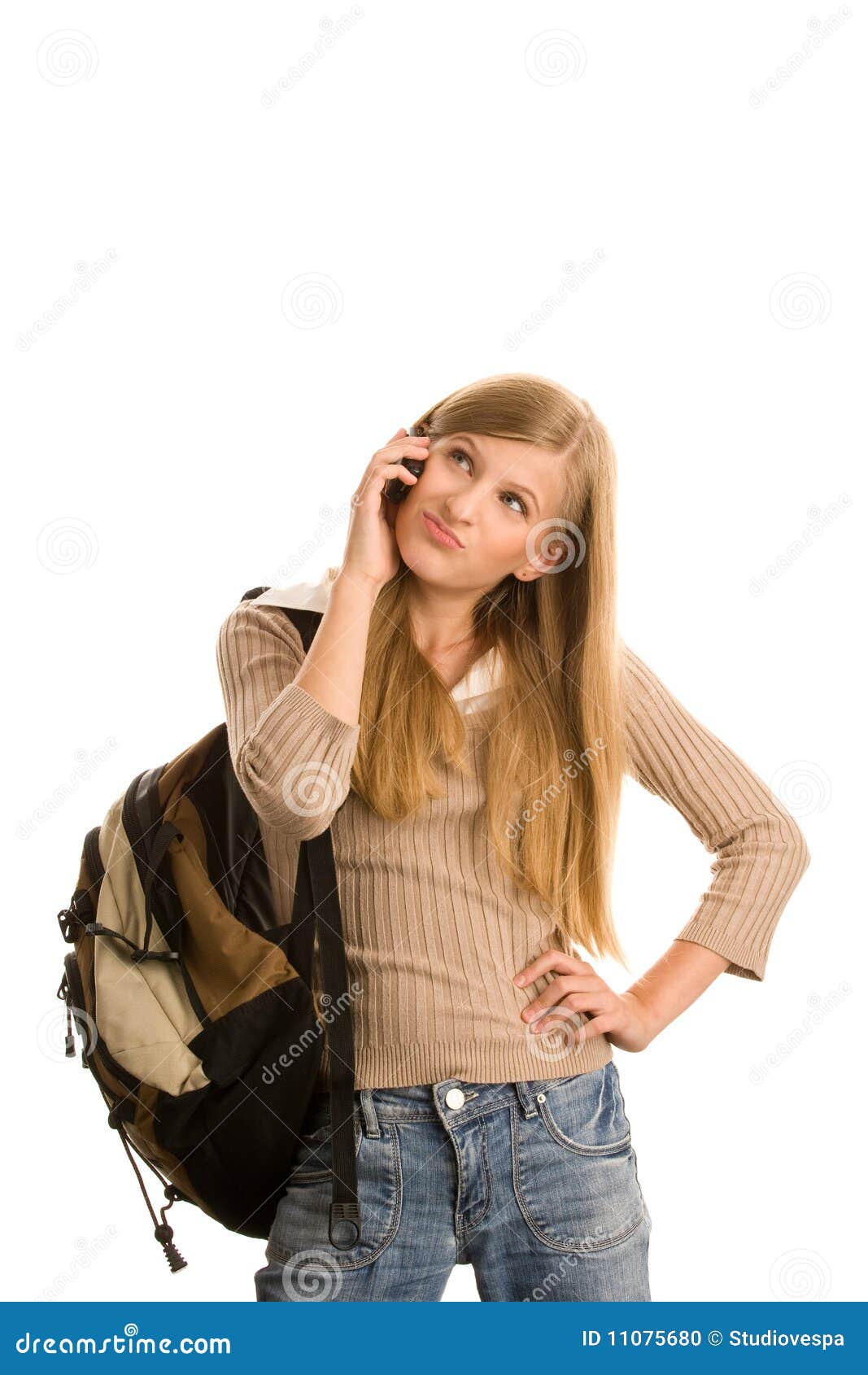 Casual teenage girl preparing to school using cell phone isolated on white background