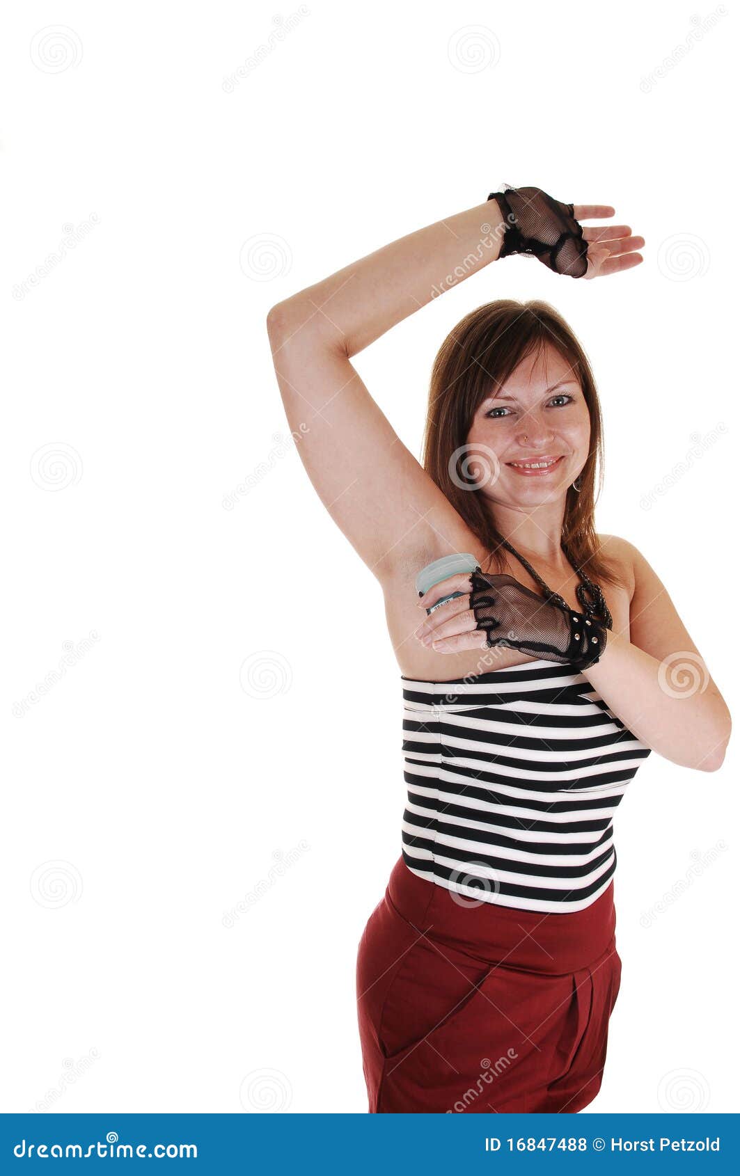 Girl putting deodorant on. stock photo. Image of care 16847488