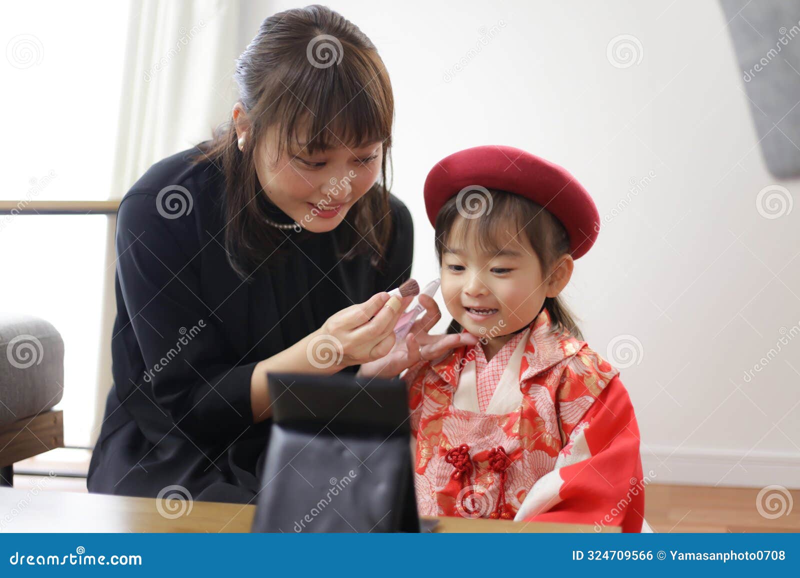 girl putting on makeup