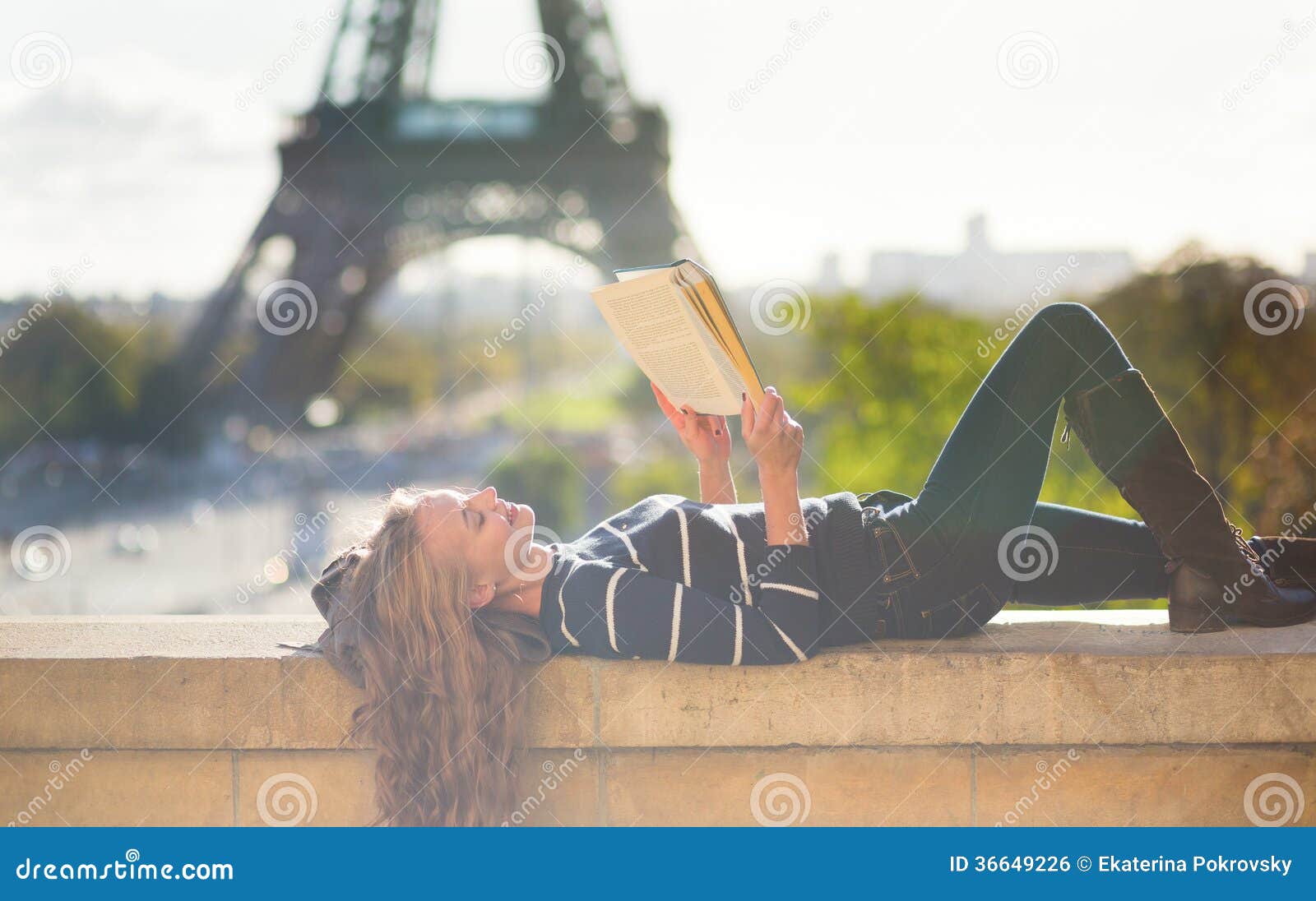 Girl Reading a Book in Paris Stock Photo Image of smiling, lying