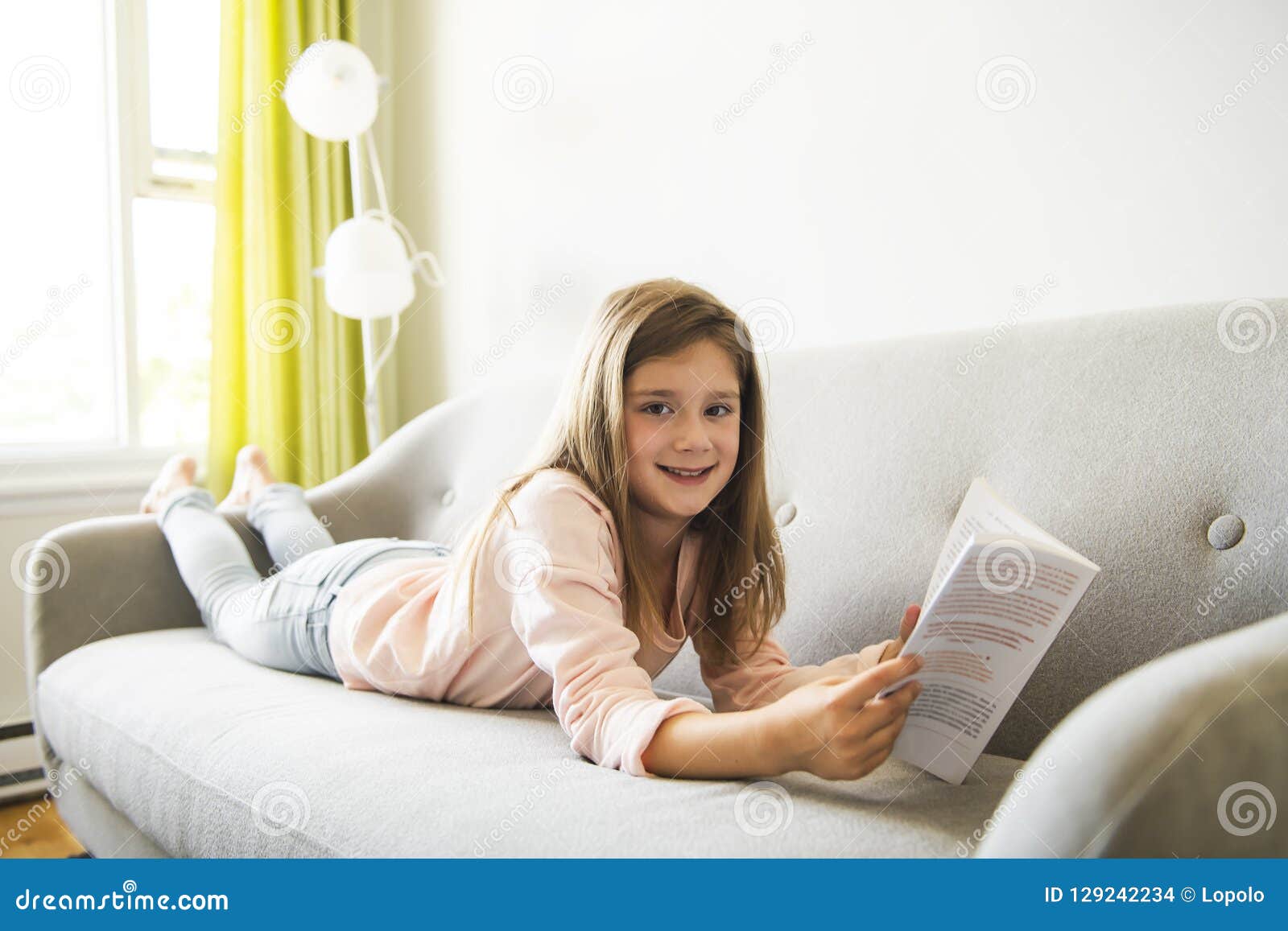 A Girl Reading In The Living Room