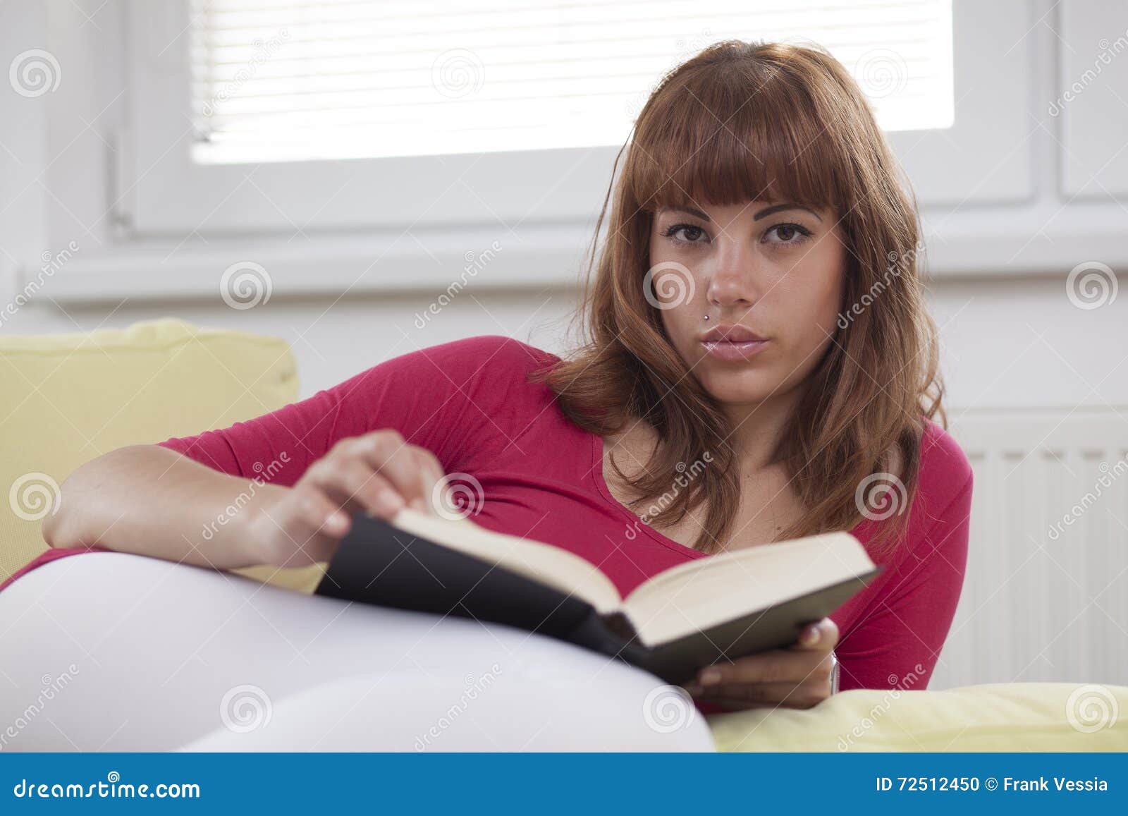 girl reading a book opened