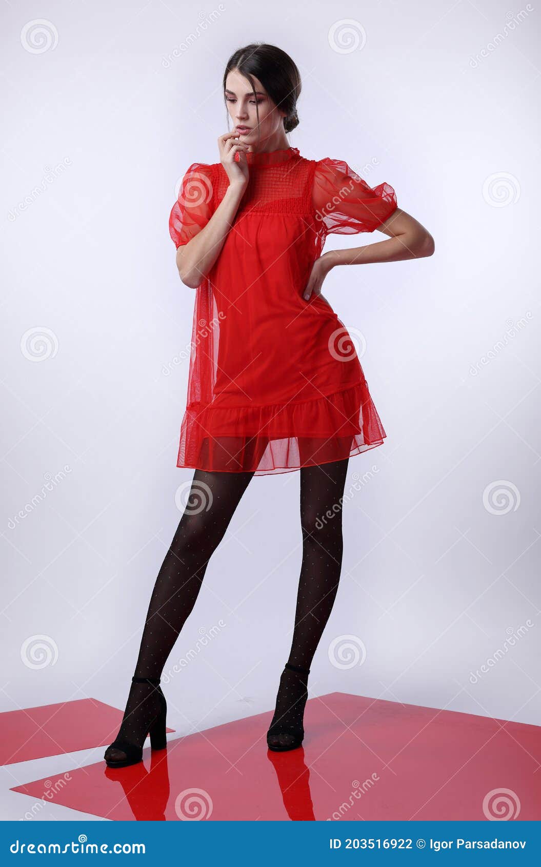 Girl in a Red Dress and Black Tights on ...