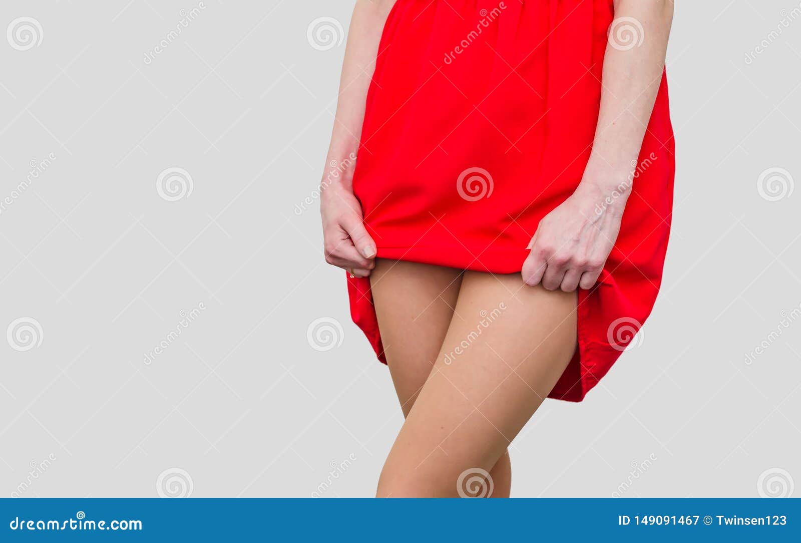 Girl in the Red Dress Lifts the Hem, Show Legs picture