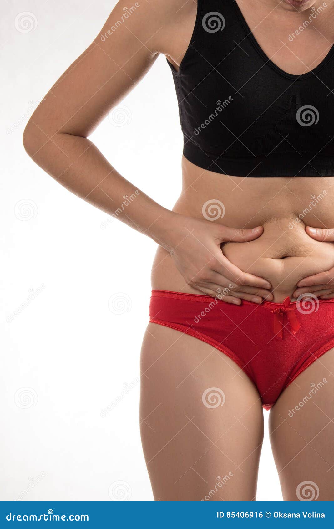 The Girl in a Red Underwear To Touch the Fat on Your Stomach and Stock  Photo - Image of apple, overweight: 85406916