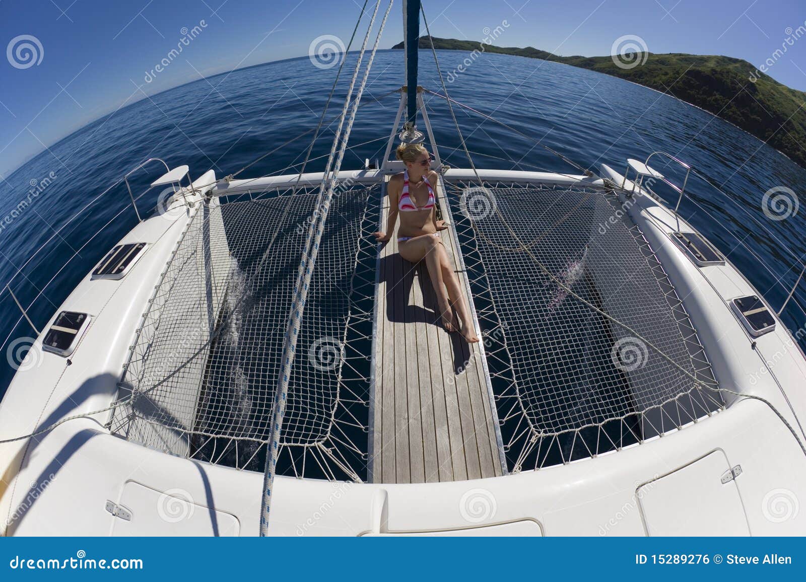 Girl Relaxing On A Catamaran - South Pacific Stock Photo 