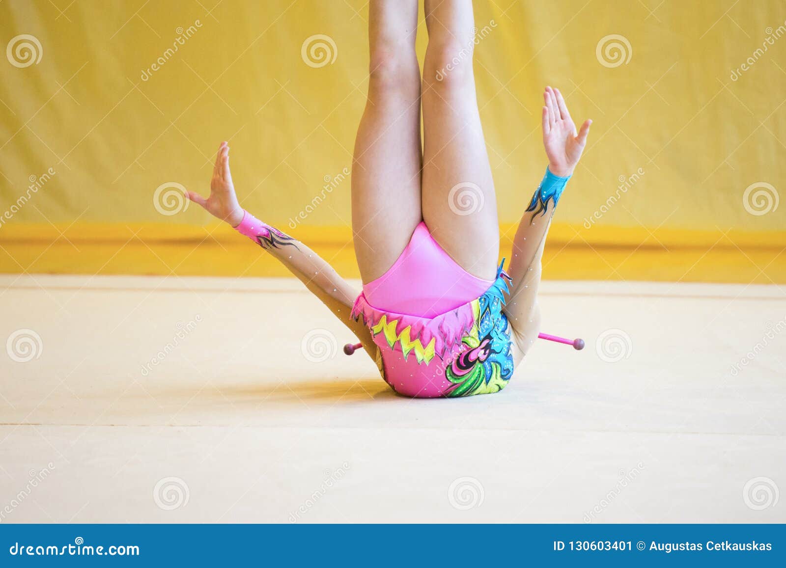 Girl with a Rhythmic Gymnastics Clubs.Flexibility in Acrobatics