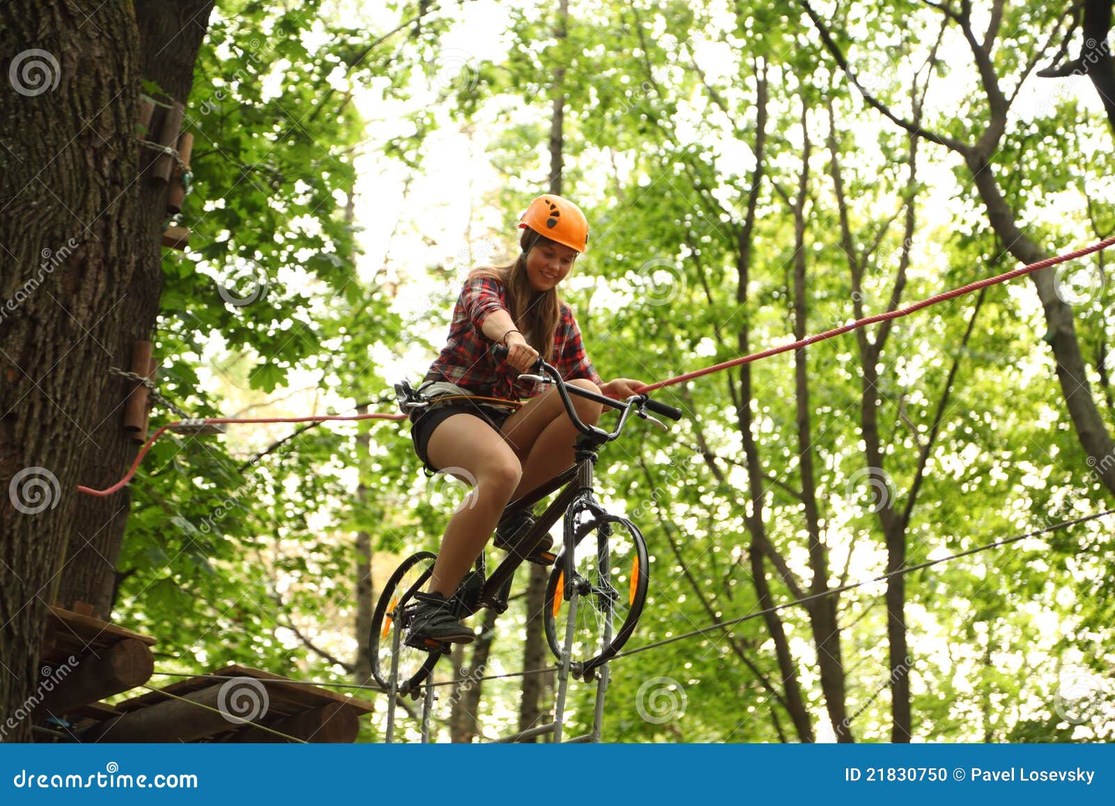Girl Riding Bicycle on Tightrope Editorial Image Image of orange