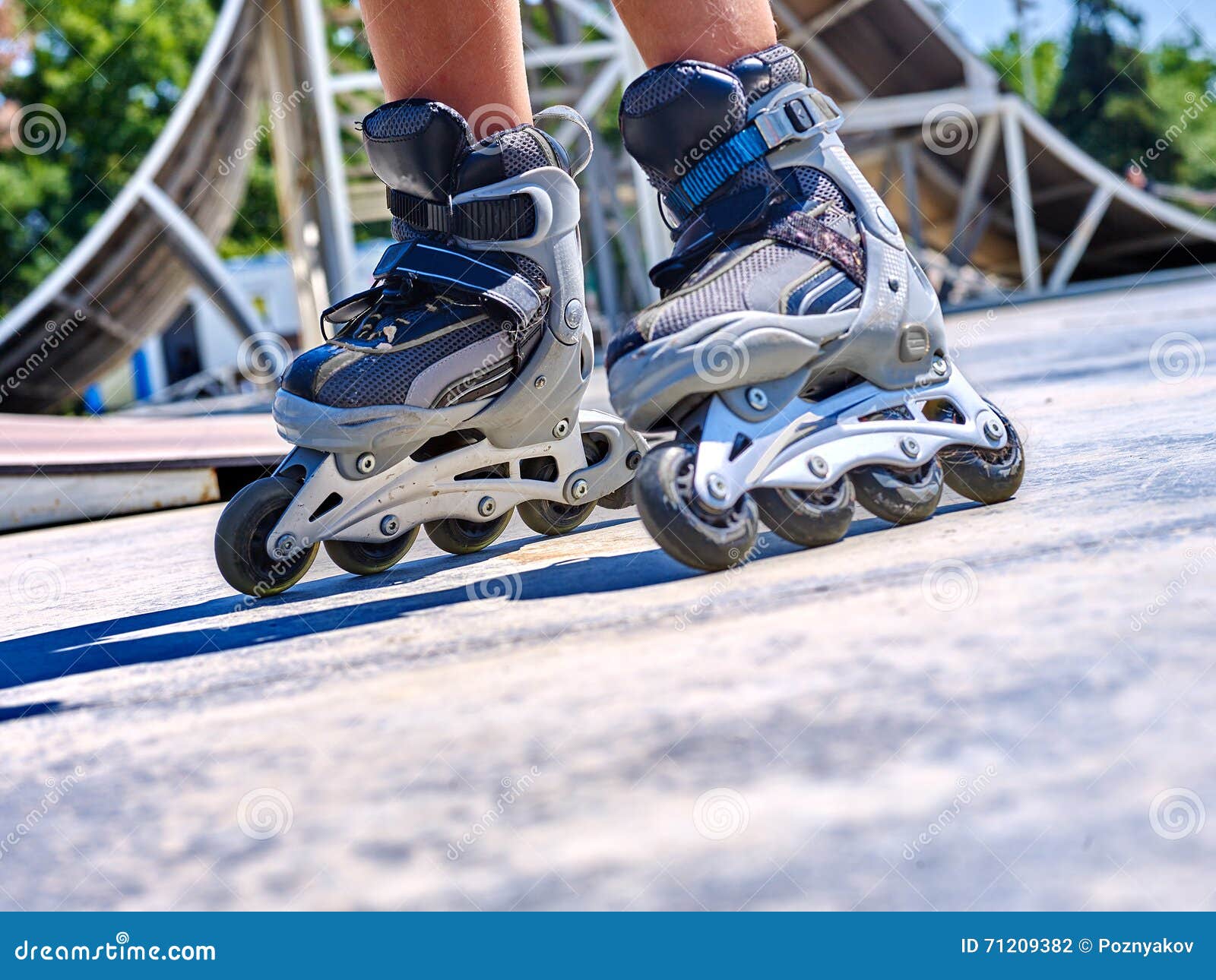 girl riding on roller skates .