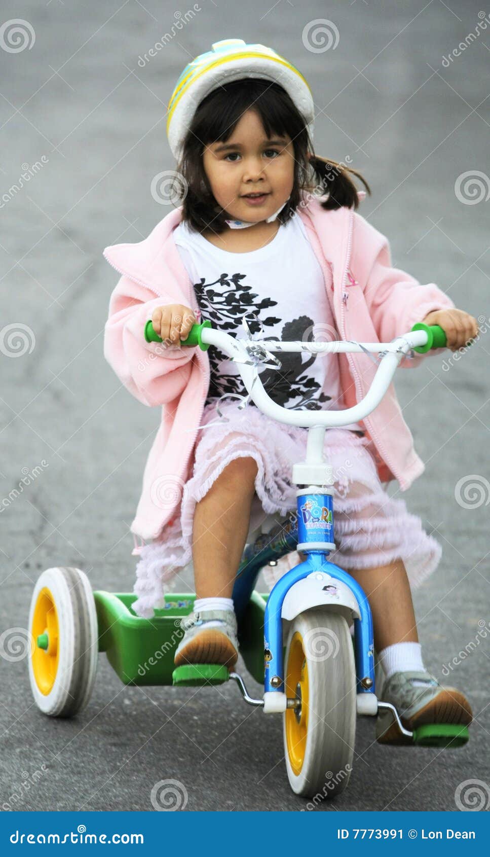 girl riding tricycle