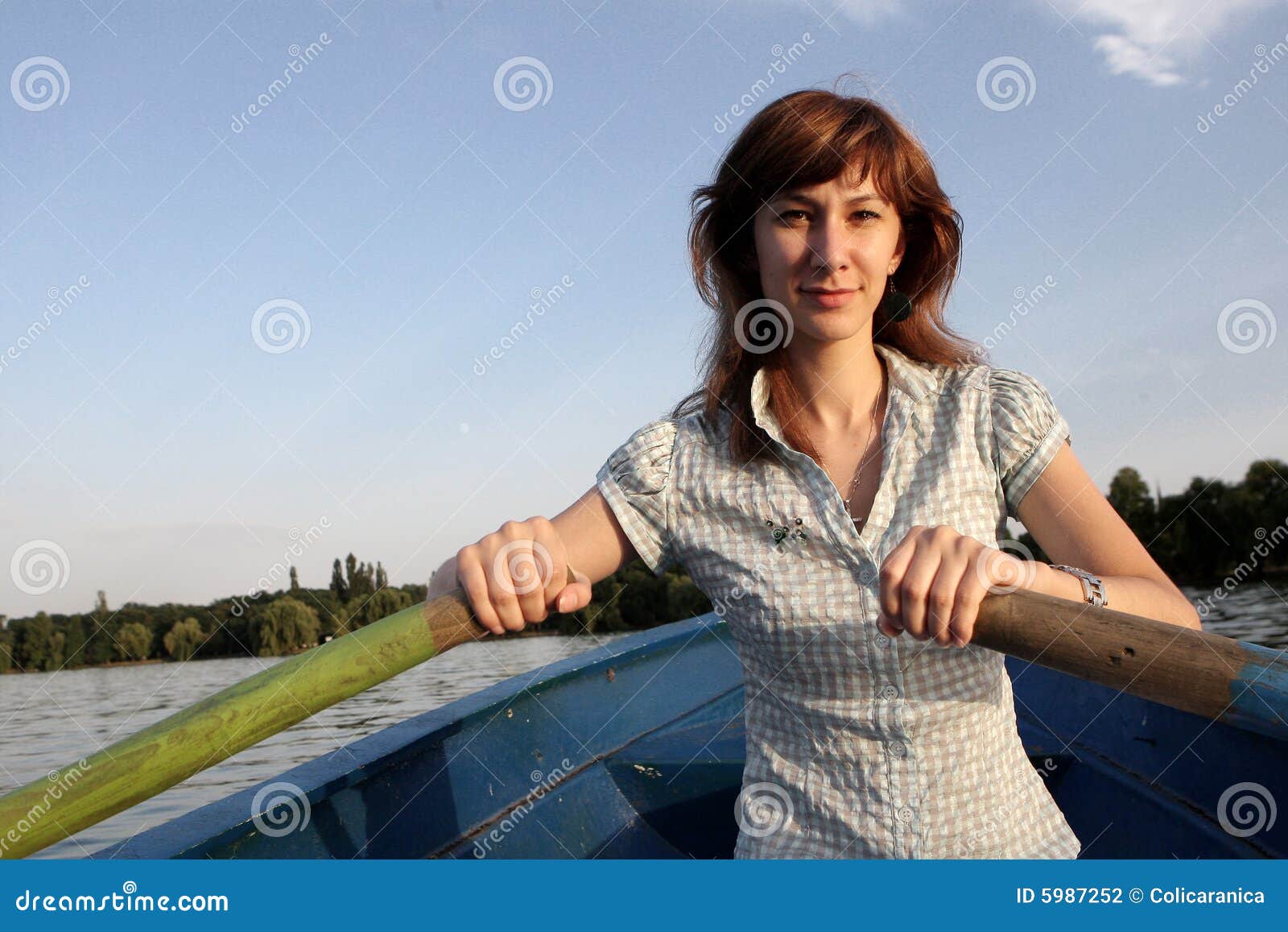 girl rowing a boat stock photo. image of teenager, light