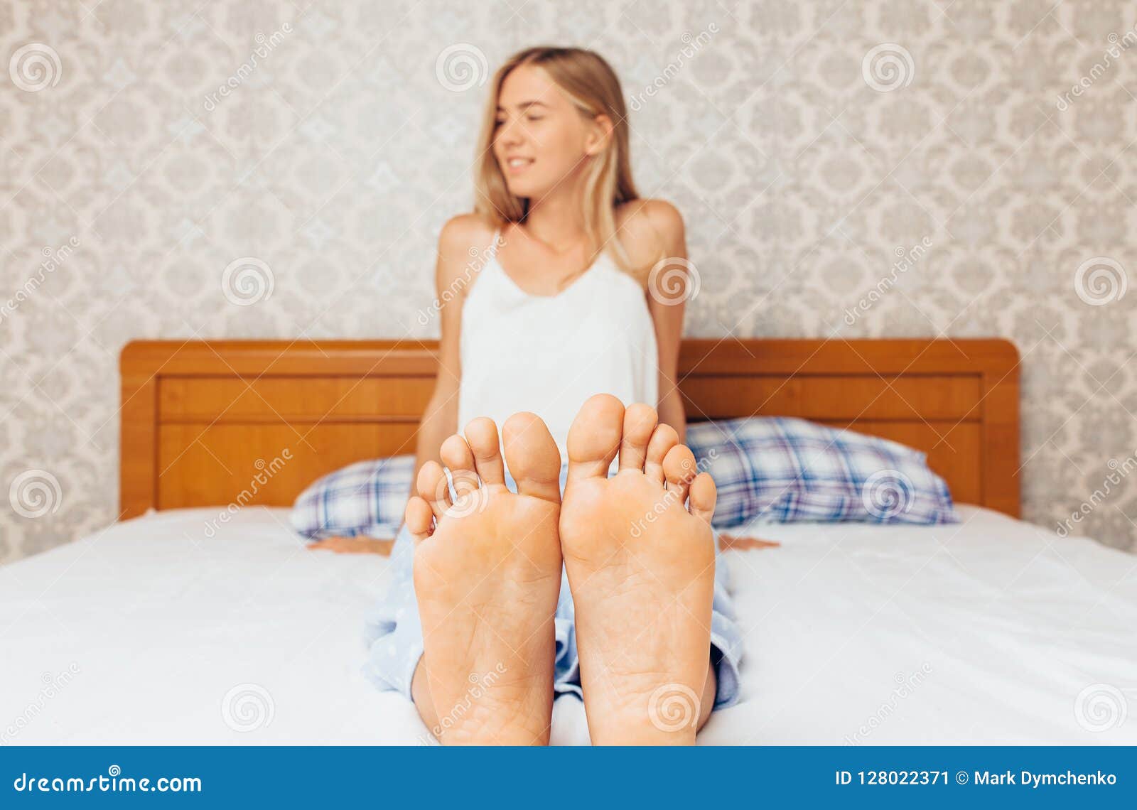 girls feet in bed photo