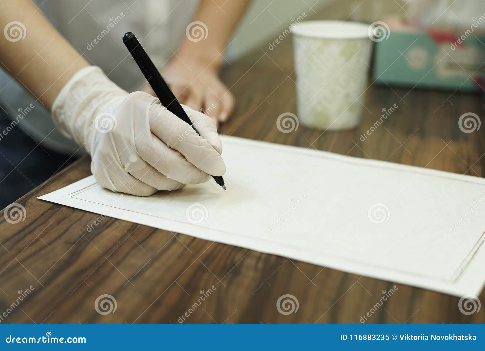The Girl`s Hand Holds a Pen on Sheet of Paper. Stock Image - Image of ...