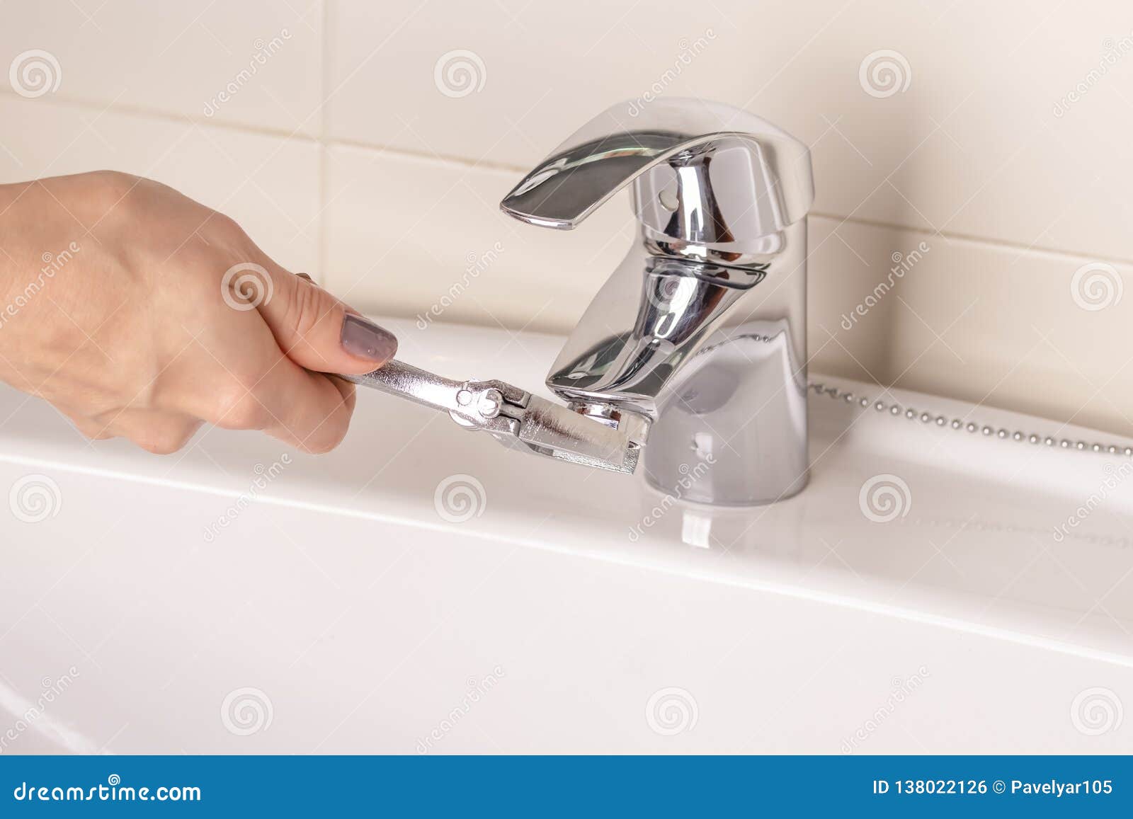 The Girl S Hand Twists Off Twists The Faucet Aerator In The