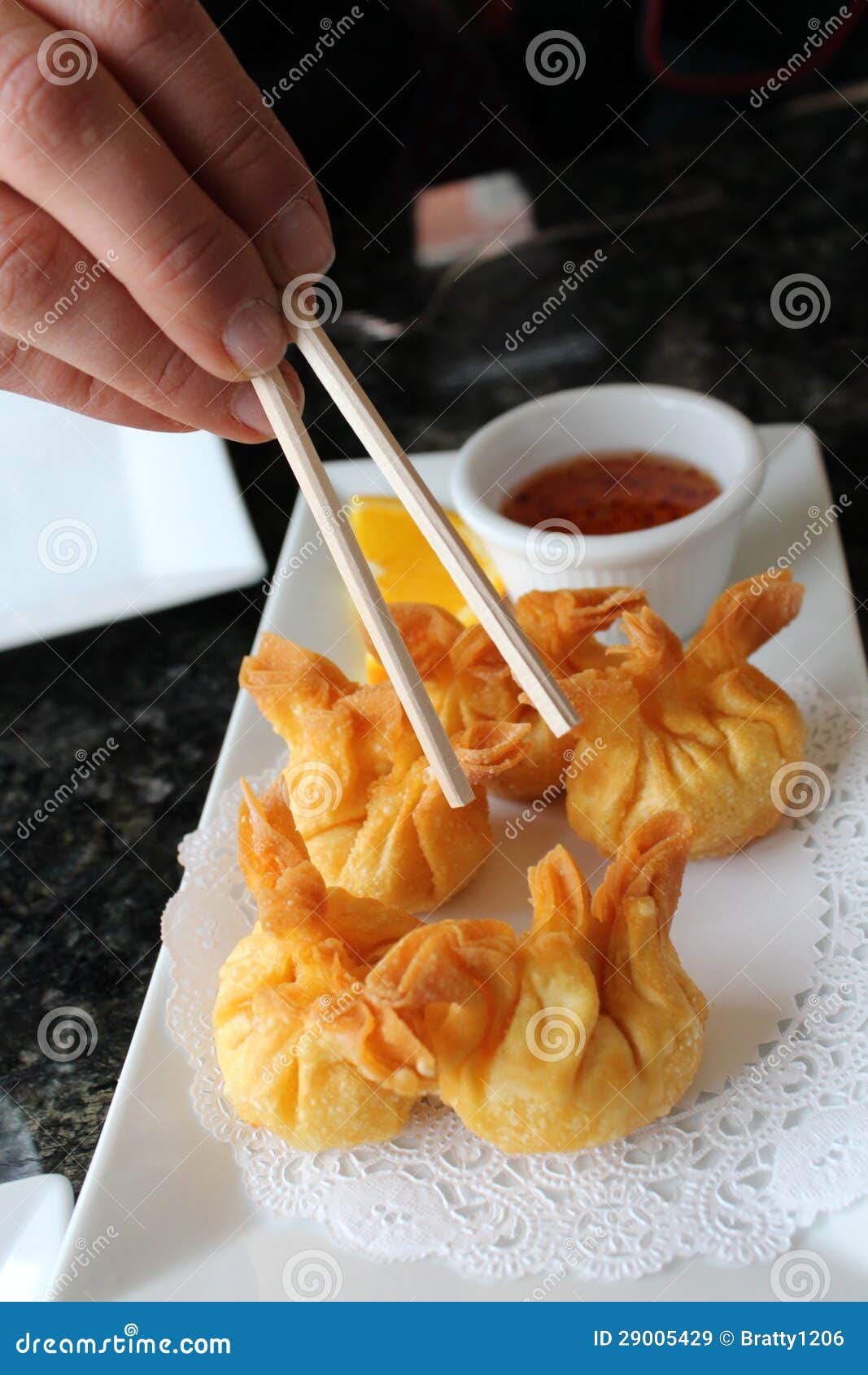 Girl S Hands with Chopsticks and Crab Rangoons Stock Image Image of