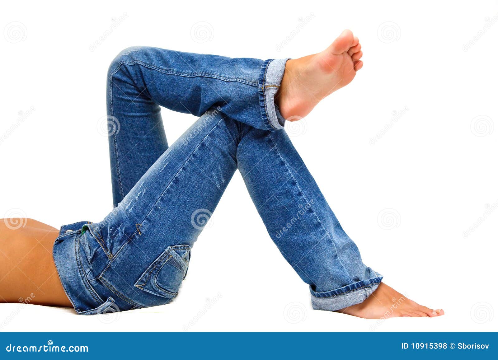 Girl s legs in blue jeans stock photo. Image of blue - 10915398