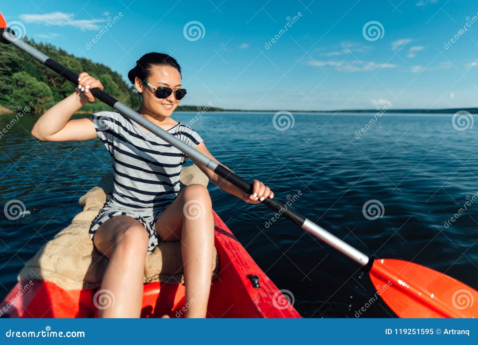Girl Sails on a Kayak, Paddles with a Paddle. Stock Image - Image of ...