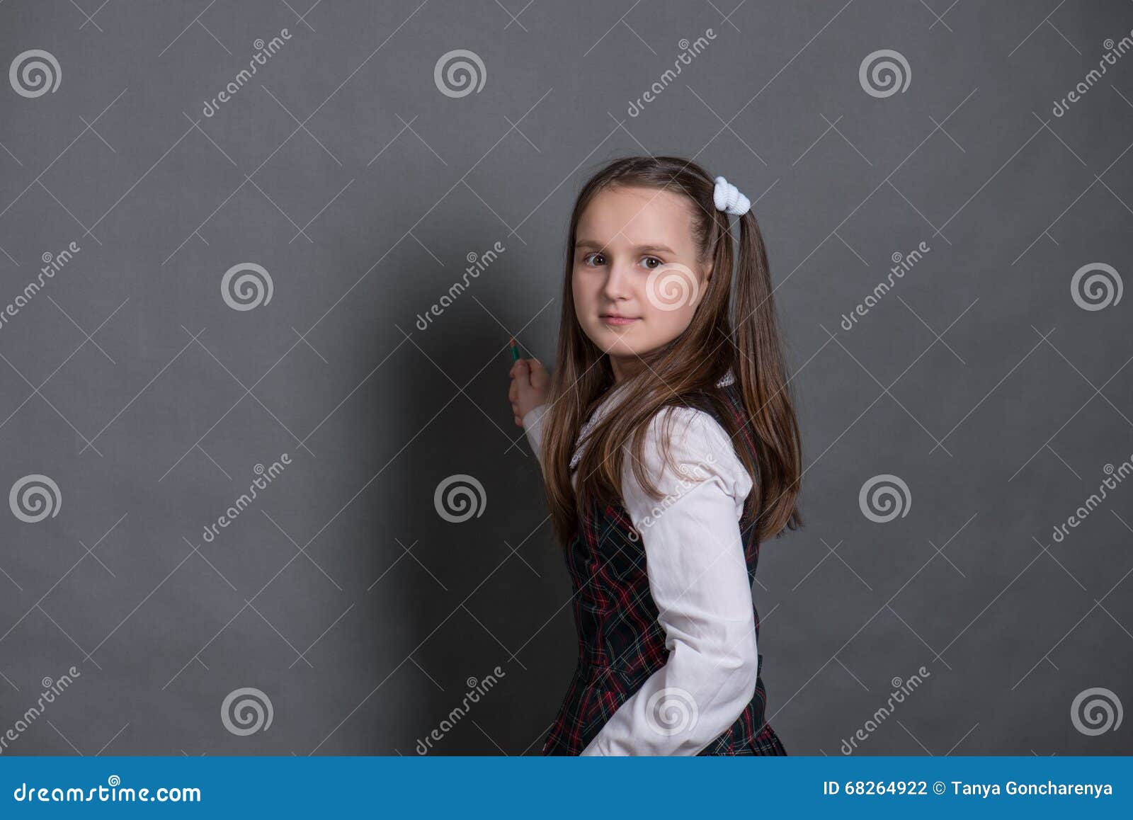 Girl in School Uniform Standing at the Chalkboard Stock Photo Image