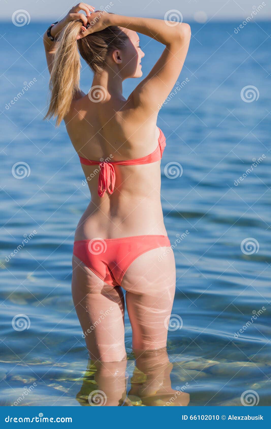 Young Woman Pink Bikini Girl Sea Adjusting Her Hairstyle Stock Photos -  Free & Royalty-Free Stock Photos from Dreamstime